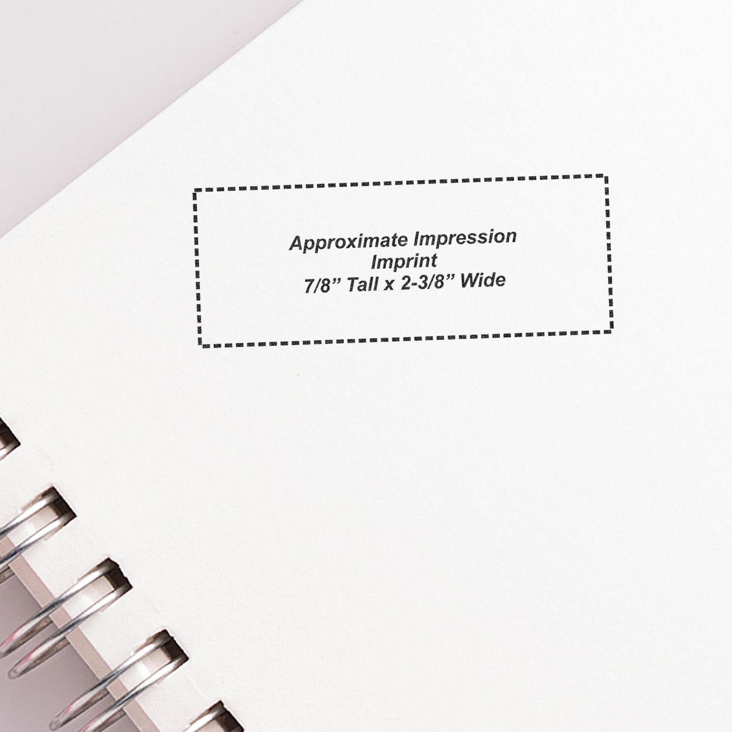 Slim Pre-Inked Progress Stamp imprint on a white notebook page, showing approximate impression size of 7/8 tall by 2-3/8 wide.