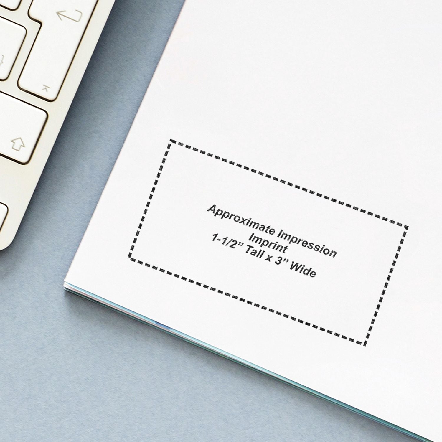 Self Inking Acknowledgment Stamp impression on white paper, showing approximate imprint size of 1-1/2 tall by 3 wide, next to a keyboard.