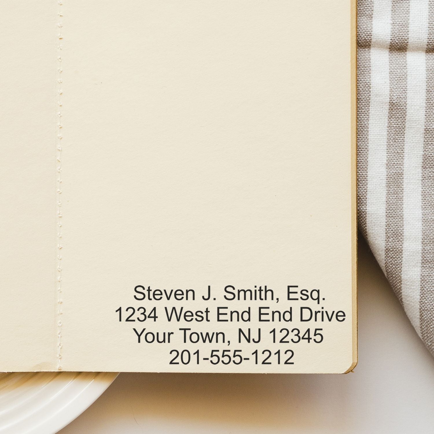 Custom Rubber Stamp Size 2 x 3 used on a beige paper, displaying text: Steven J. Smith, Esq. 1234 West End End Drive Your Town, NJ 12345 201-555-1212 .