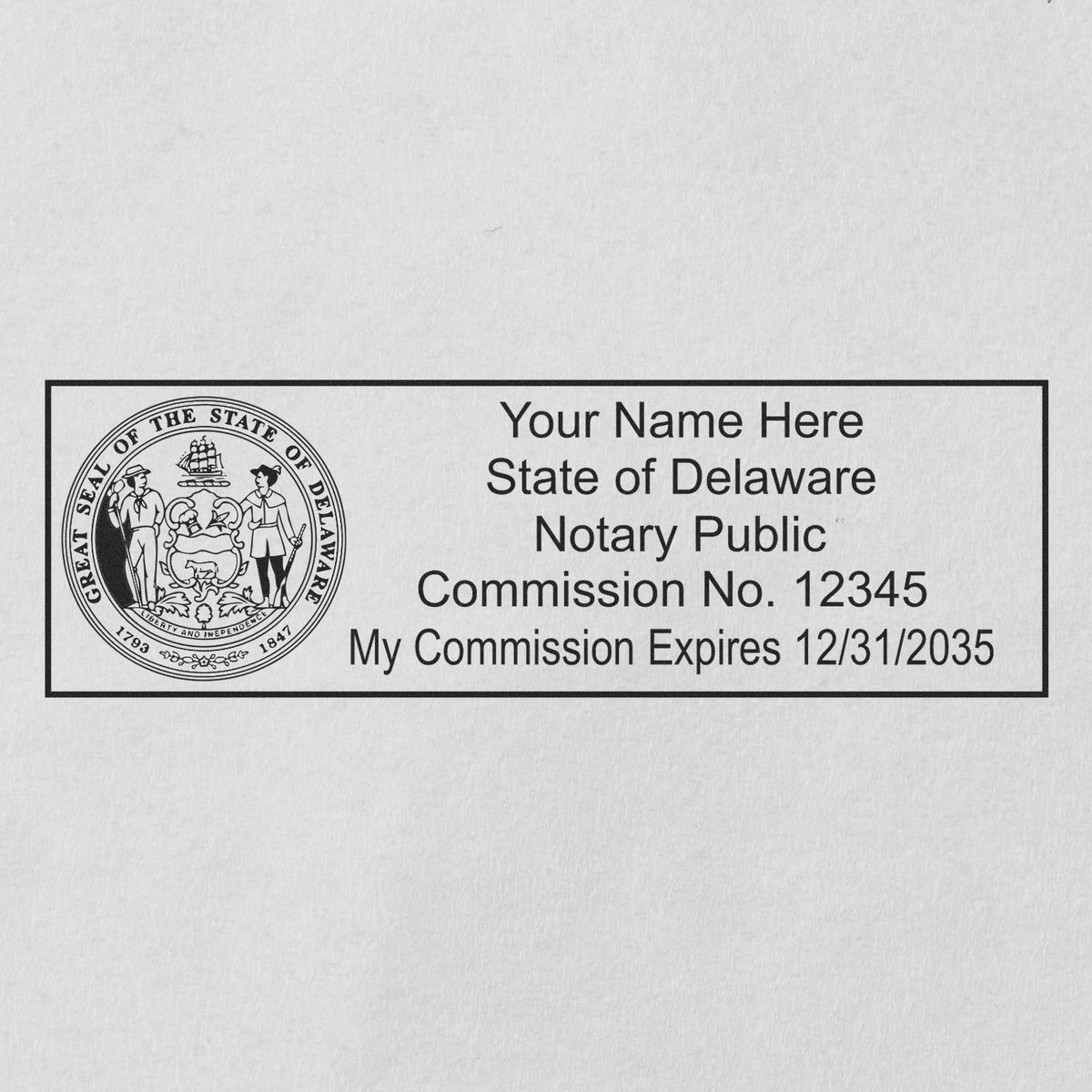 A lifestyle photo showing a stamped image of the Wooden Handle Delaware State Seal Notary Public Stamp on a piece of paper