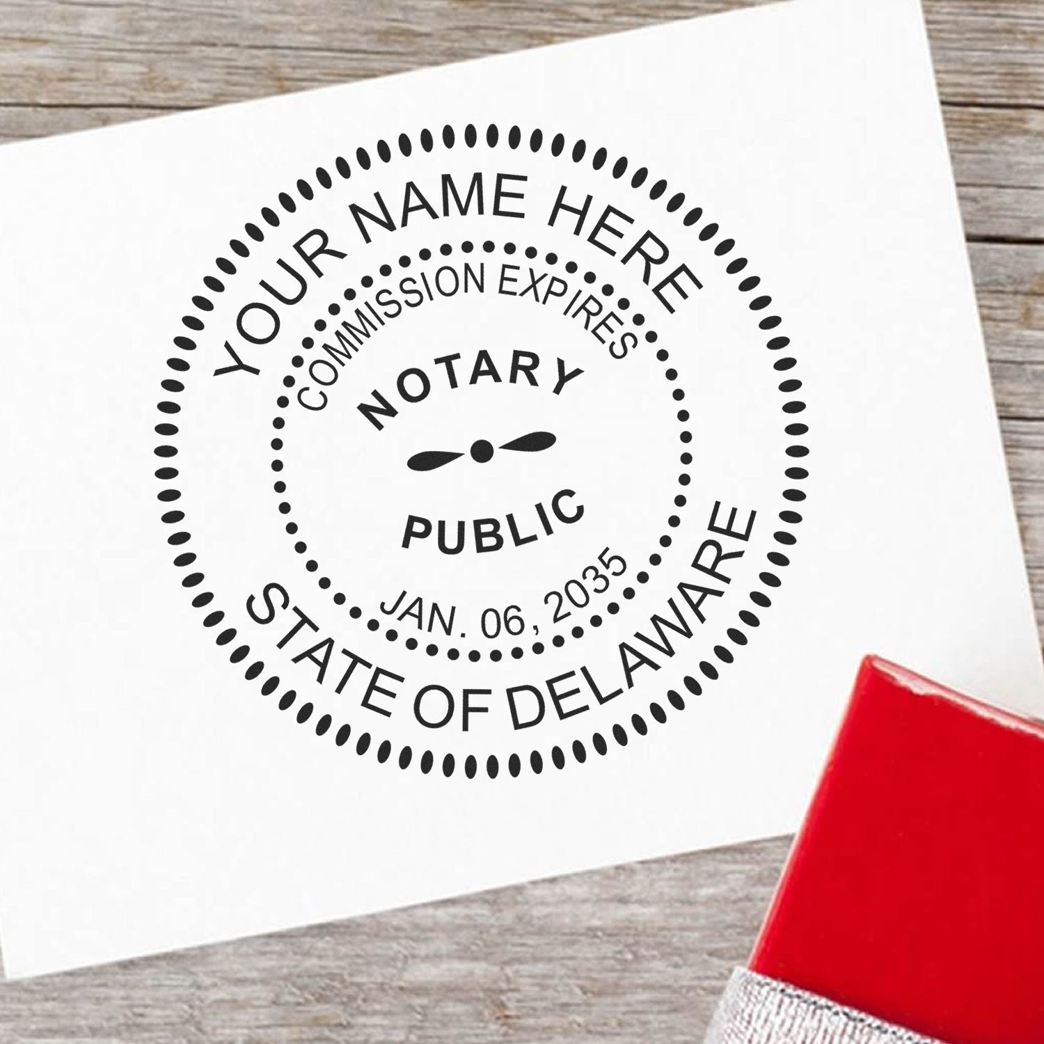 Round Delaware Notary Public Seal Stamp in use photo showing a stamped imprint of the Round Delaware Notary Public Seal Stamp