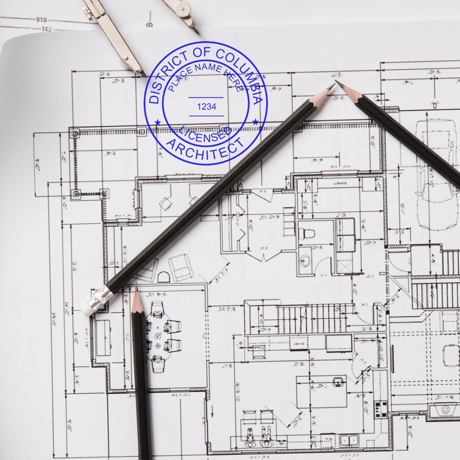 District of Columbia Architect Seal Stamp on architectural blueprint with pencils and drafting tools.