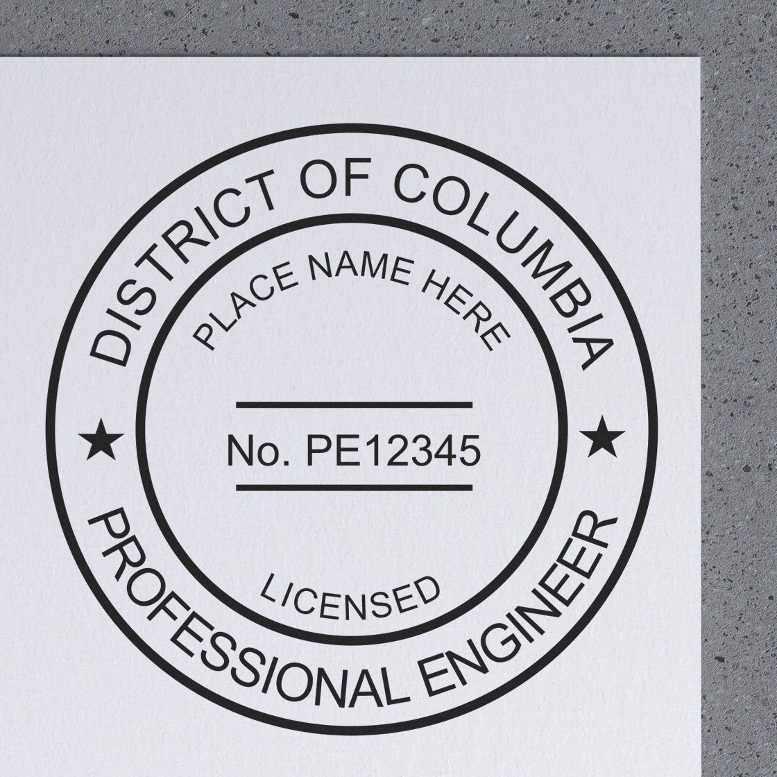 This paper is stamped with a sample imprint of the District of Columbia Professional Engineer Seal Stamp, signifying its quality and reliability.