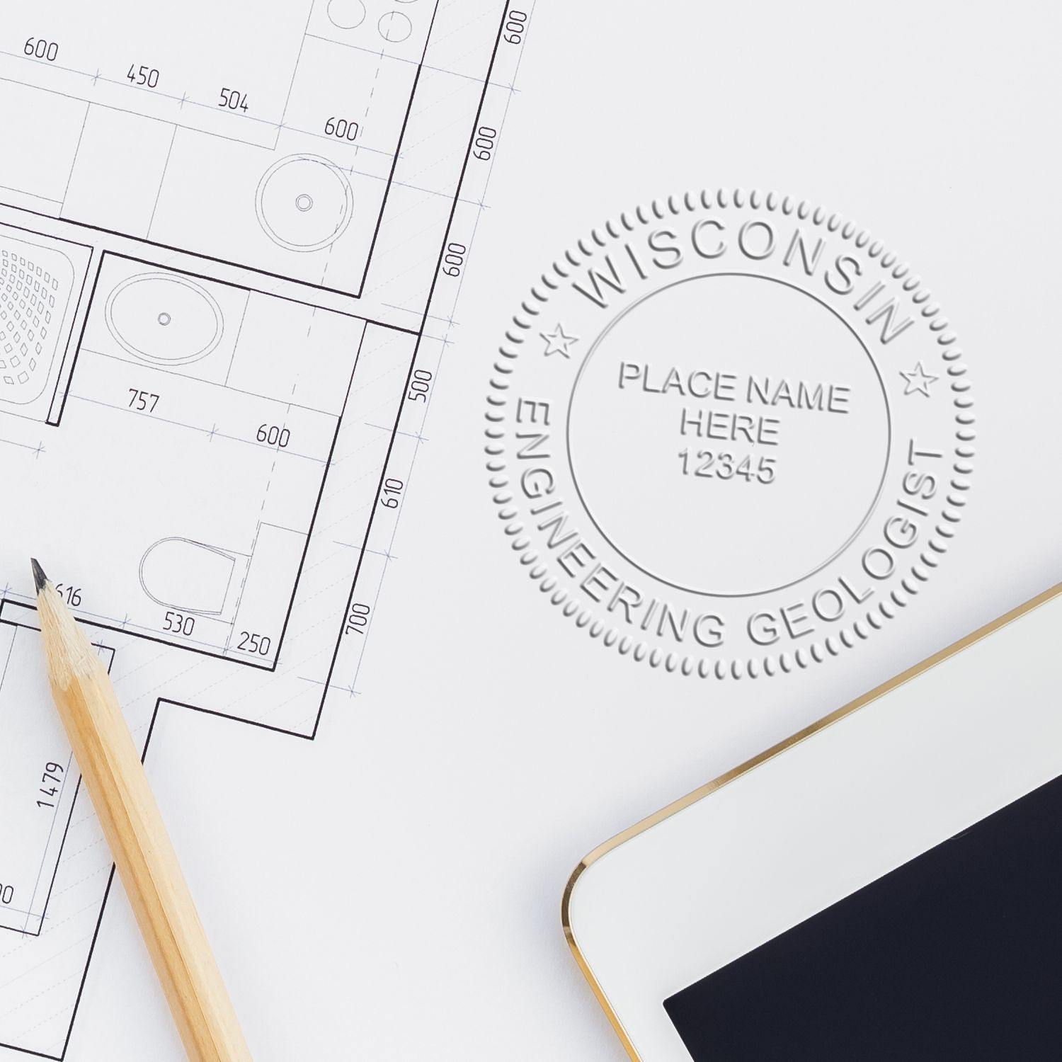 Engineering Geologist Chrome Gift Seal Embosser imprint on a technical drawing with a pencil and tablet nearby.