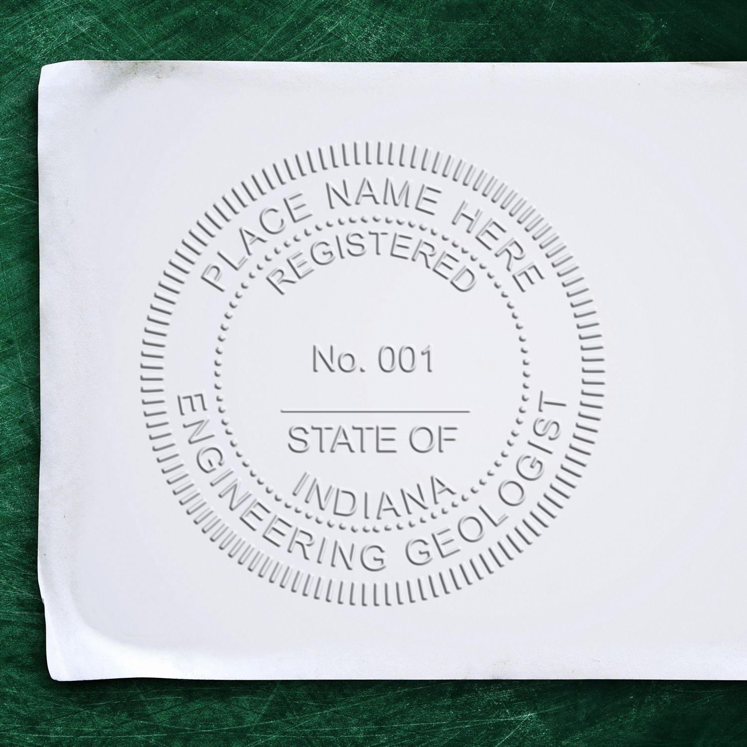 Close-up of a white paper embossed with an official seal using the Engineering Geologist Black Gift Seal Embosser, displaying 'Registered Engineering Geologist' and 'State of Indiana' text.