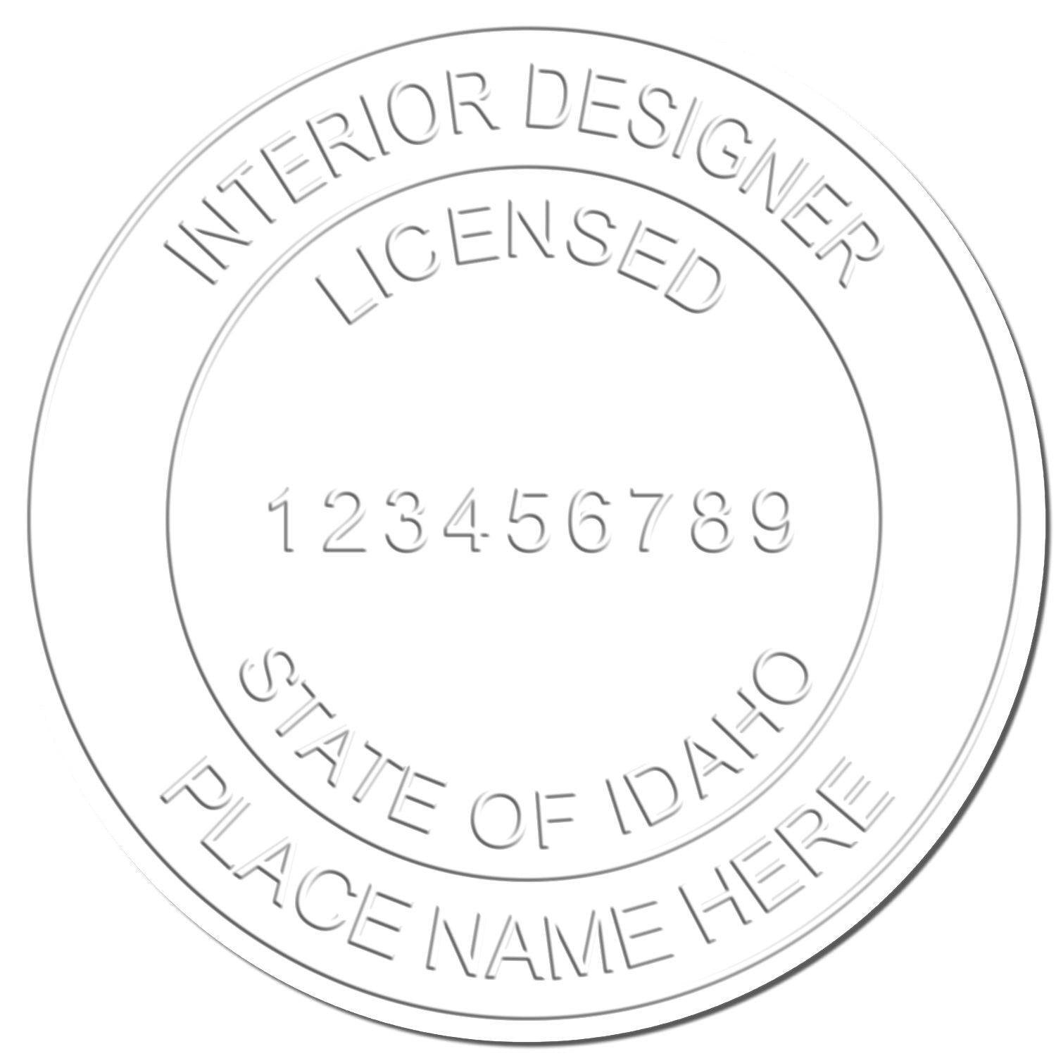 Embossed seal with text Interior Designer Licensed, State of Idaho, Place Name Here created using the Interior Designer Chrome Gift Seal Embosser.