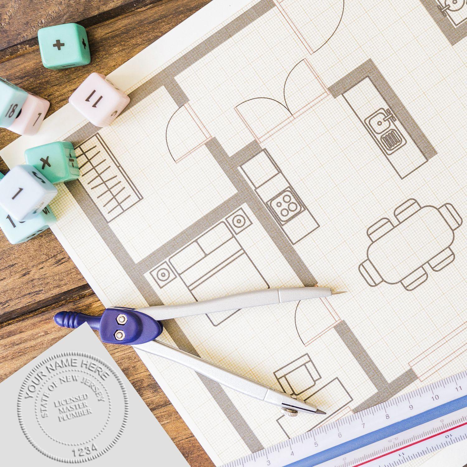 Professional Pink Gift Embosser in use on a floor plan, surrounded by drafting tools and pastel-colored dice on a wooden table.