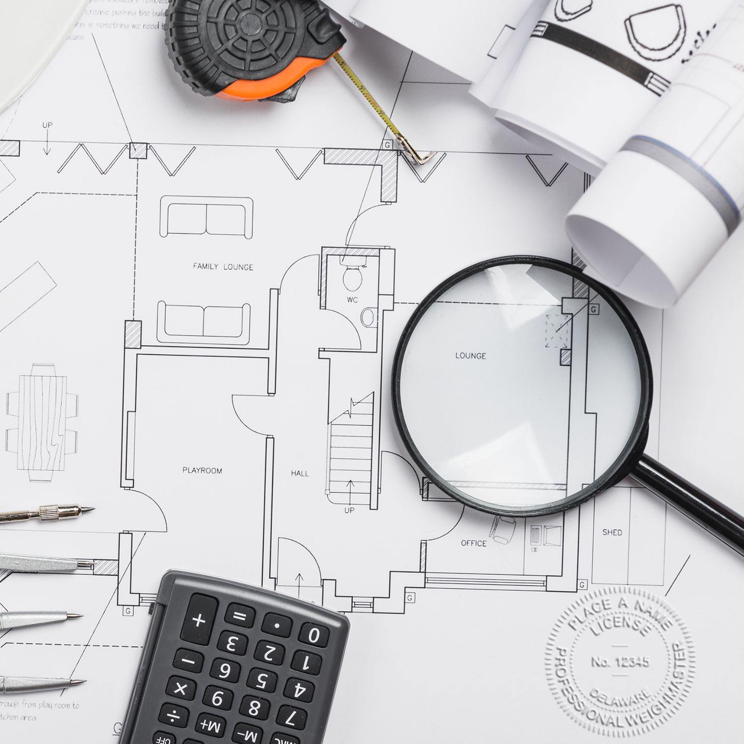 Public Weighmaster Black Gift Seal Embosser used on architectural plans, surrounded by a magnifying glass, calculator, and drafting tools.