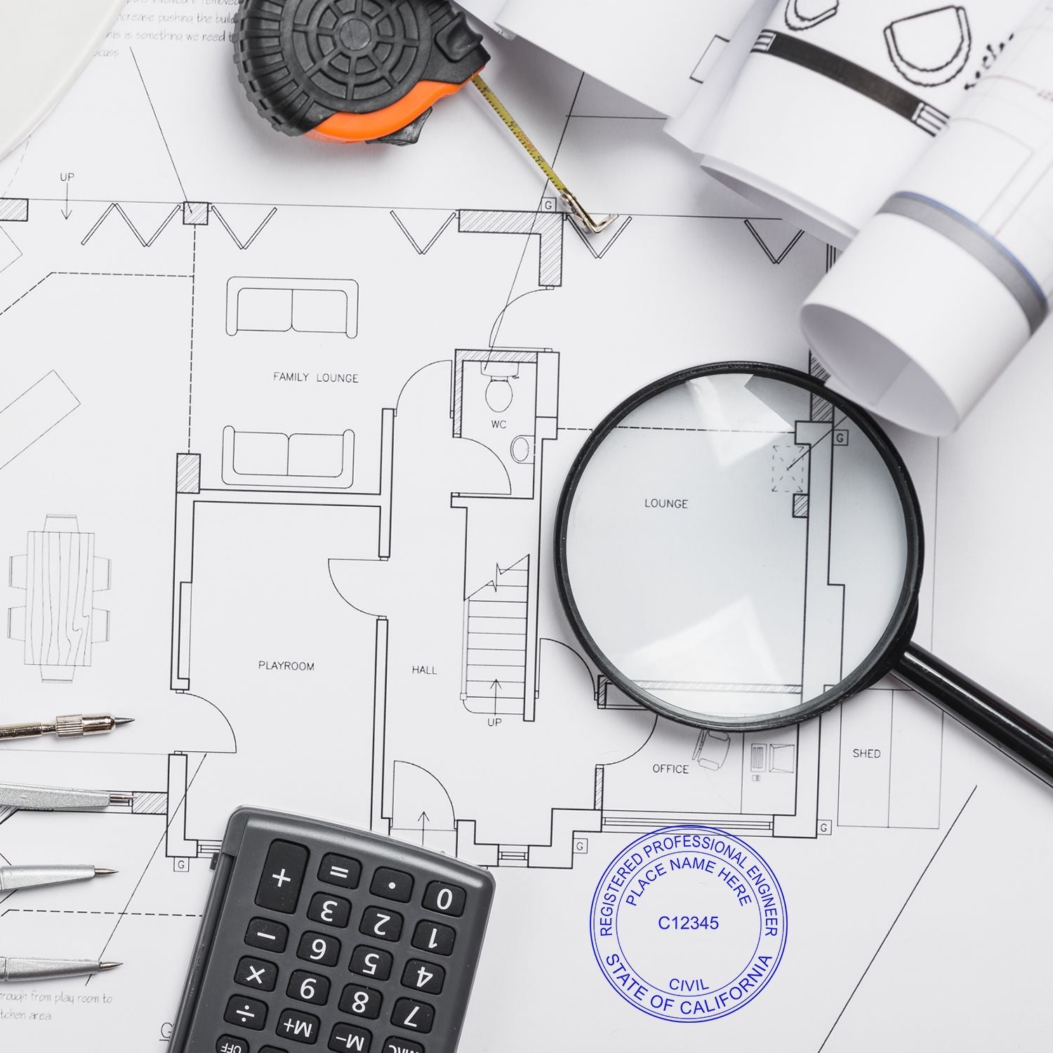 A desk with architectural blueprints, a magnifying glass, a calculator, a tape measure, and a Professional Engineer Regular Rubber Stamp of Seal marked on the blueprint.