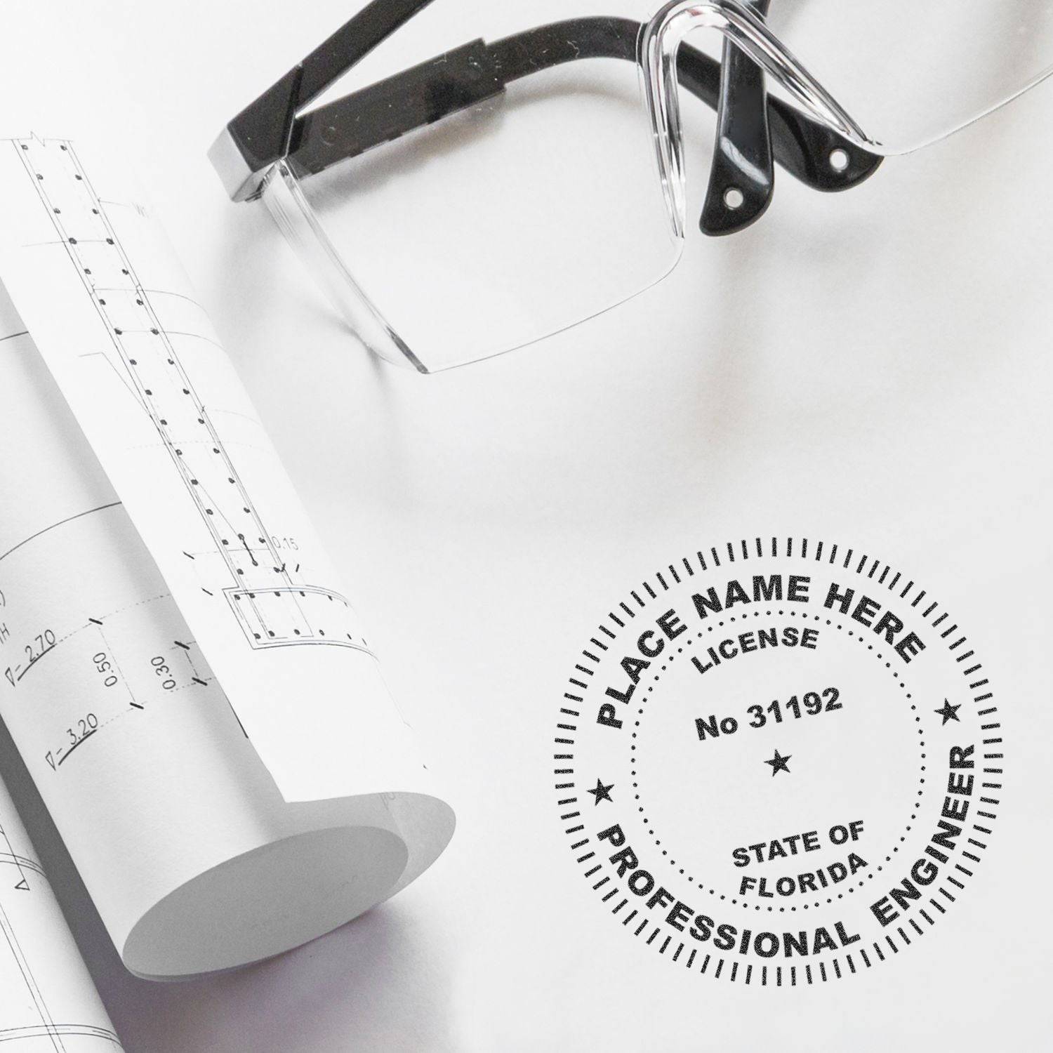 Professional Engineer Slim Pre-Inked Stamp of Seal on a white paper with engineering drawings and a pair of glasses nearby. The stamp displays a customizable seal for licensed engineers in Florida.