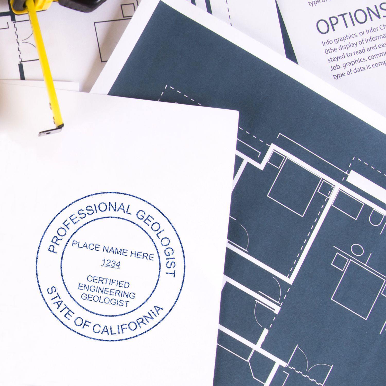 Engineering Geologist MaxLight Pre-Inked Rubber Stamp of Seal in use on a document, displaying a professional geologist certification seal with blueprints and paperwork in the background.