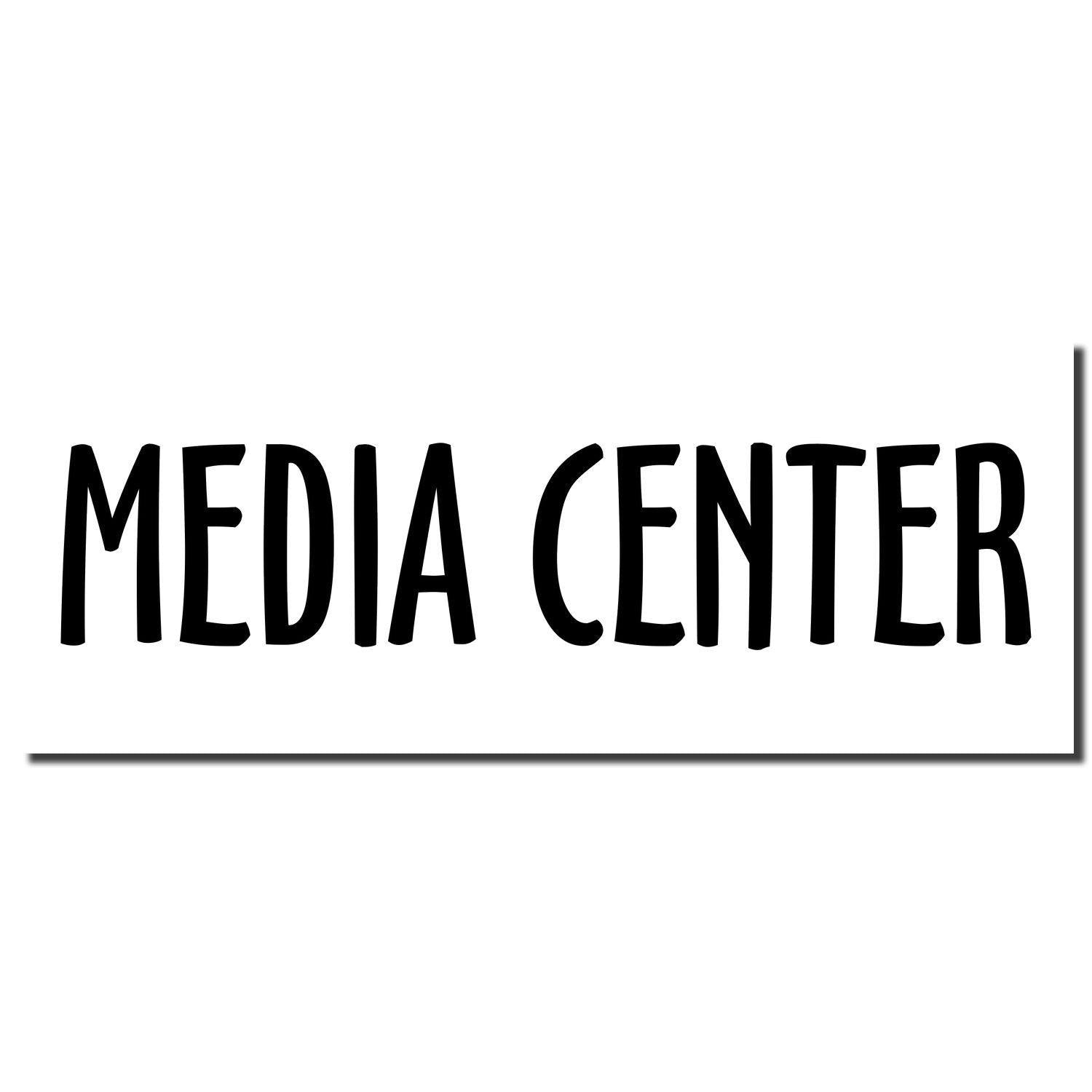 Black 'Media Center' imprint from a Slim Pre-Inked Media Center Stamp on a white background.