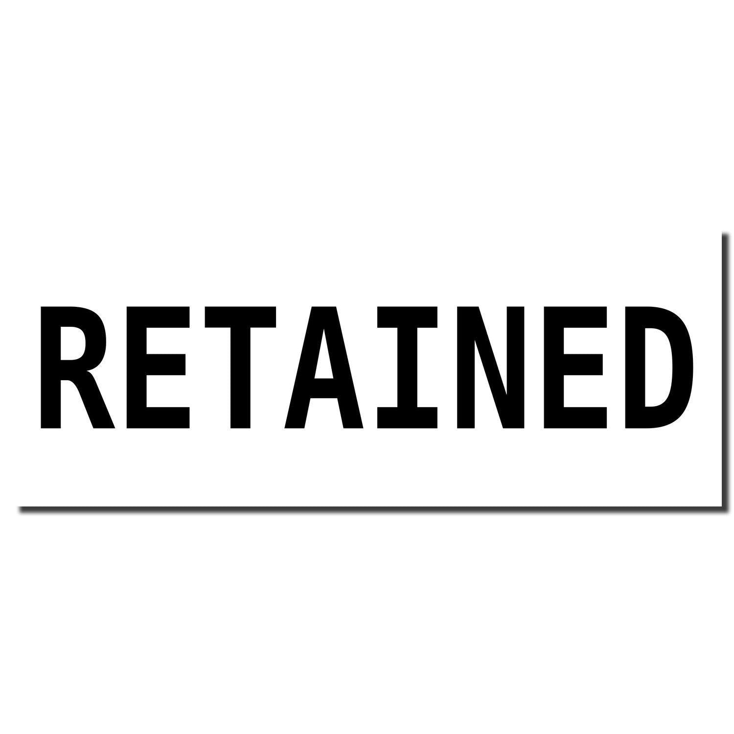 Image of a Retained Rubber Stamp imprint in bold black letters on a white background.