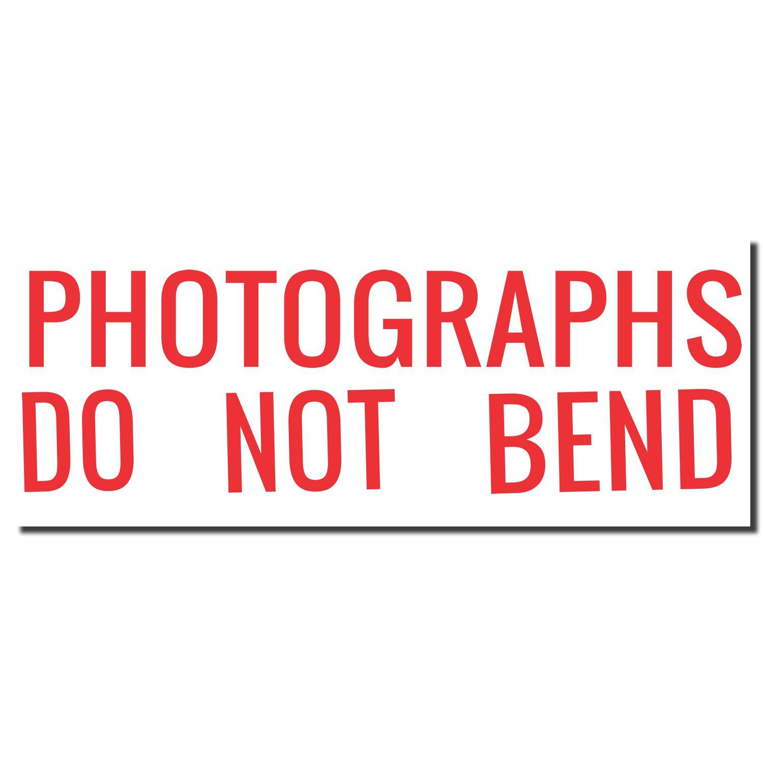 Jumbo Photographs Do Not Bend Xstamper Stamp imprint in bold red letters on a white background.