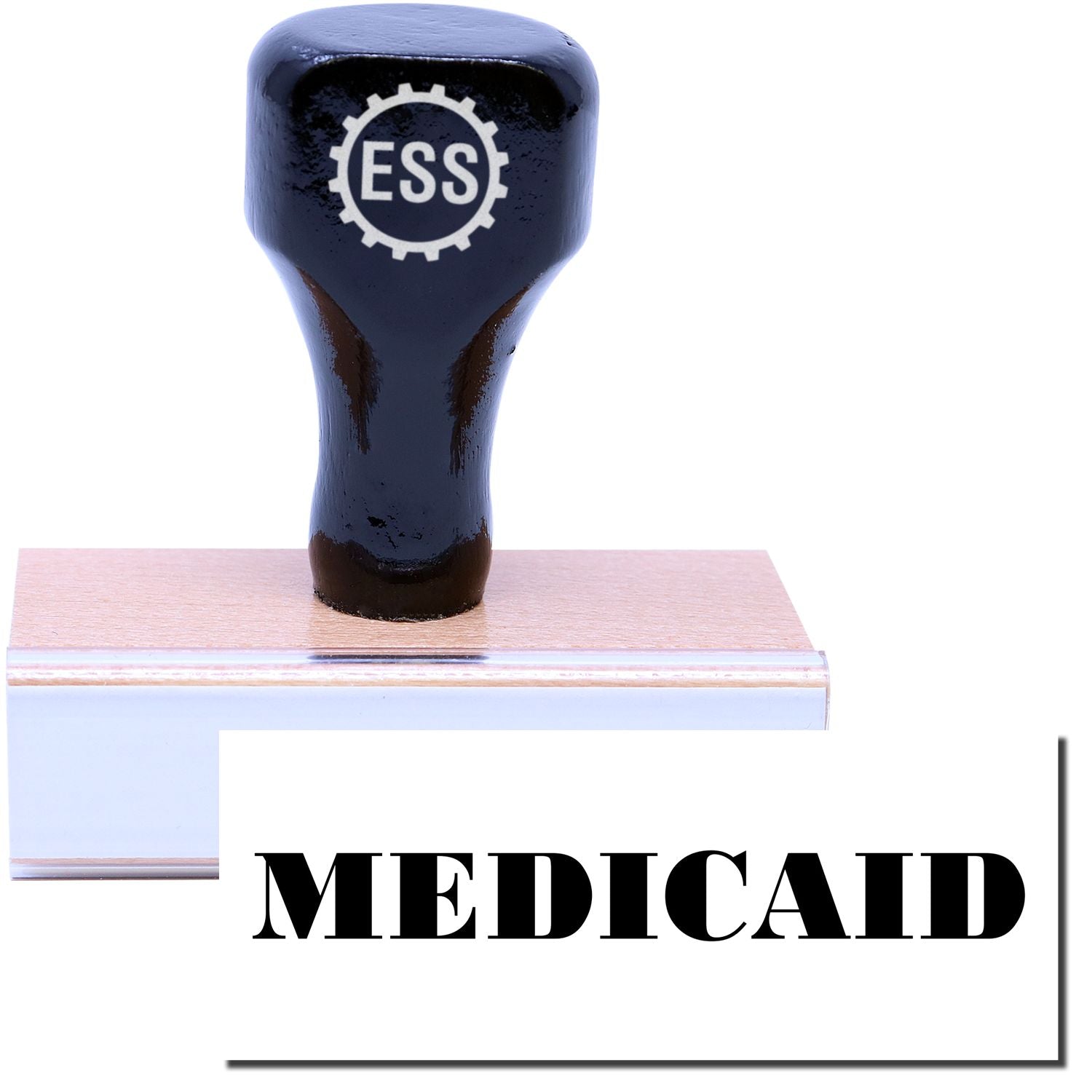 A stock office rubber stamp with a stamped image showing how the text "MEDICAID" is displayed after stamping.