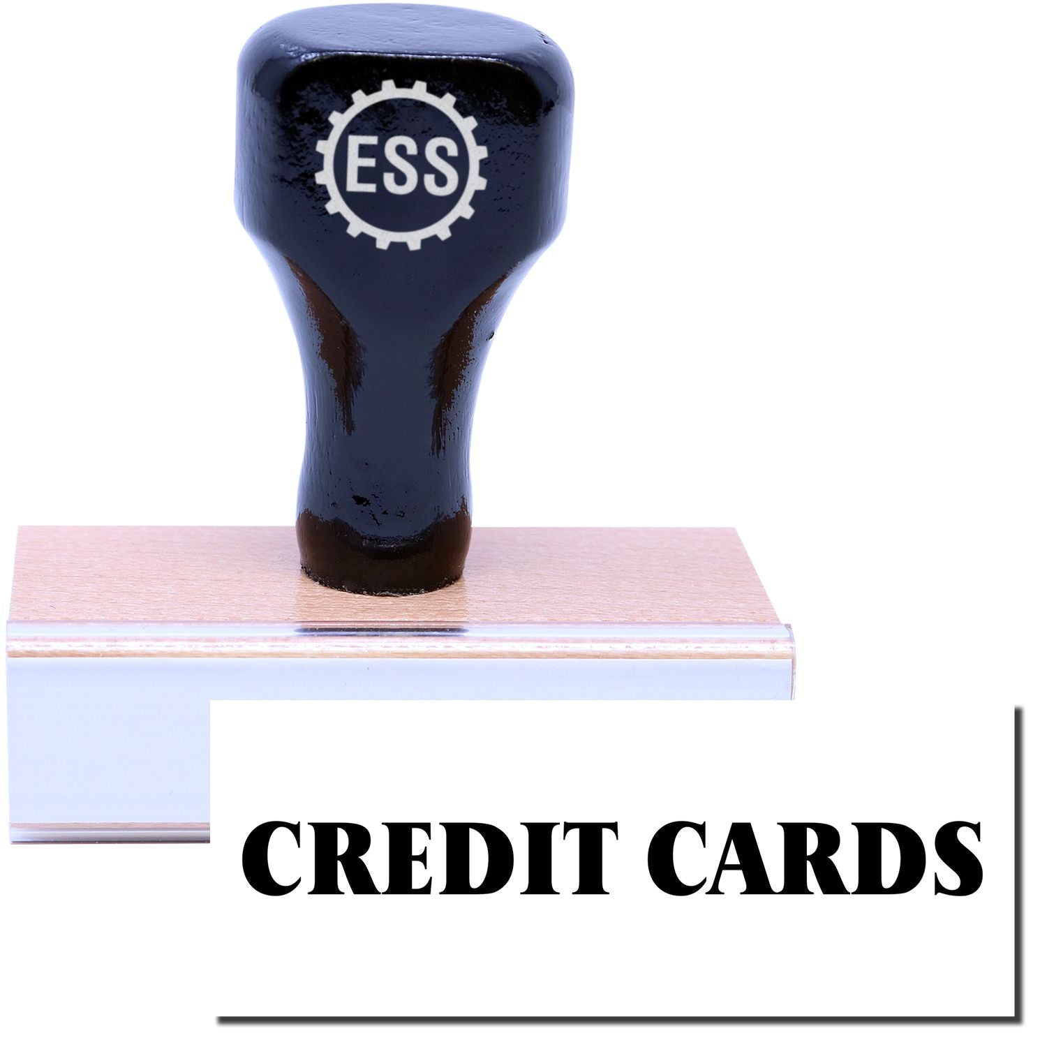 A stock office rubber stamp with a stamped image showing how the text CREDIT CARDS is displayed after stamping.