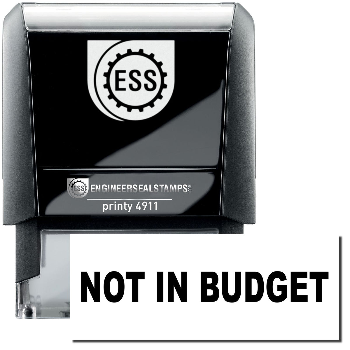 A self-inking stamp with a stamped image showing how the text &quot;NOT IN BUDGET&quot; is displayed after stamping.