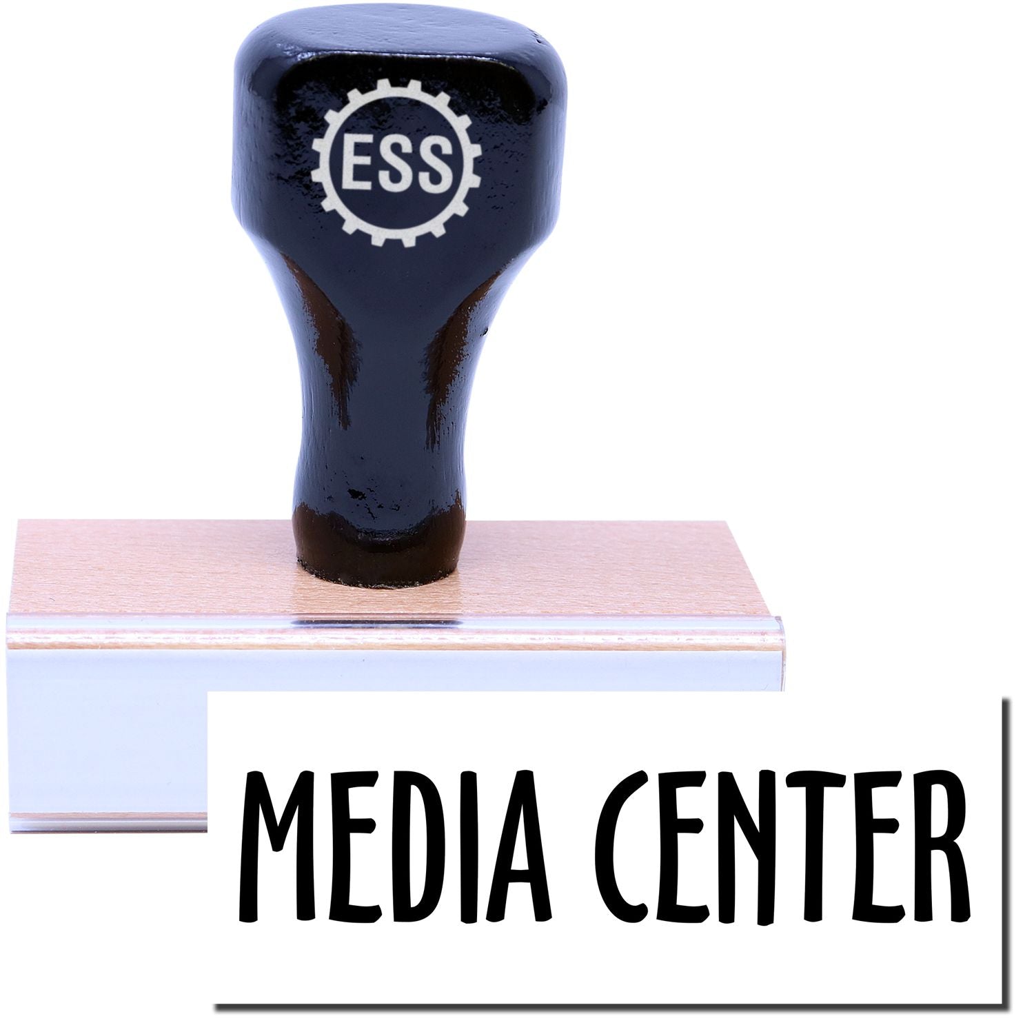A stock office rubber stamp with a stamped image showing how the text "MEDIA CENTER" is displayed after stamping.