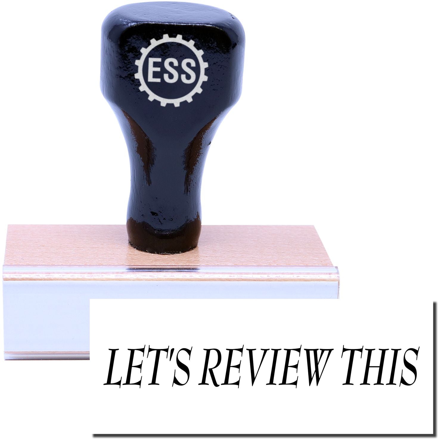 A stock office rubber stamp with a stamped image showing how the text "LET'S REVIEW THIS" is displayed after stamping.
