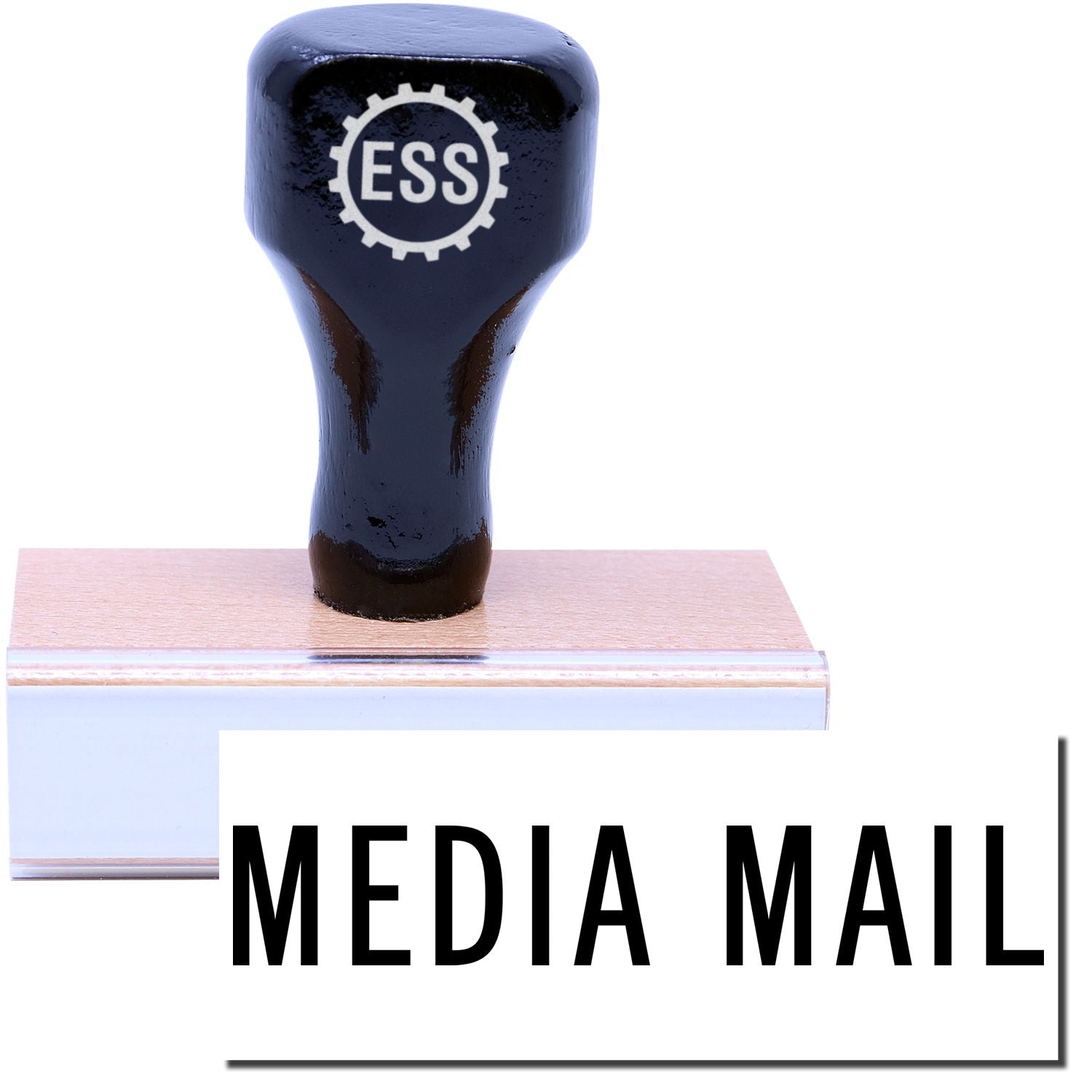 A stock office rubber stamp with a stamped image showing how the text MEDIA MAIL is displayed after stamping.