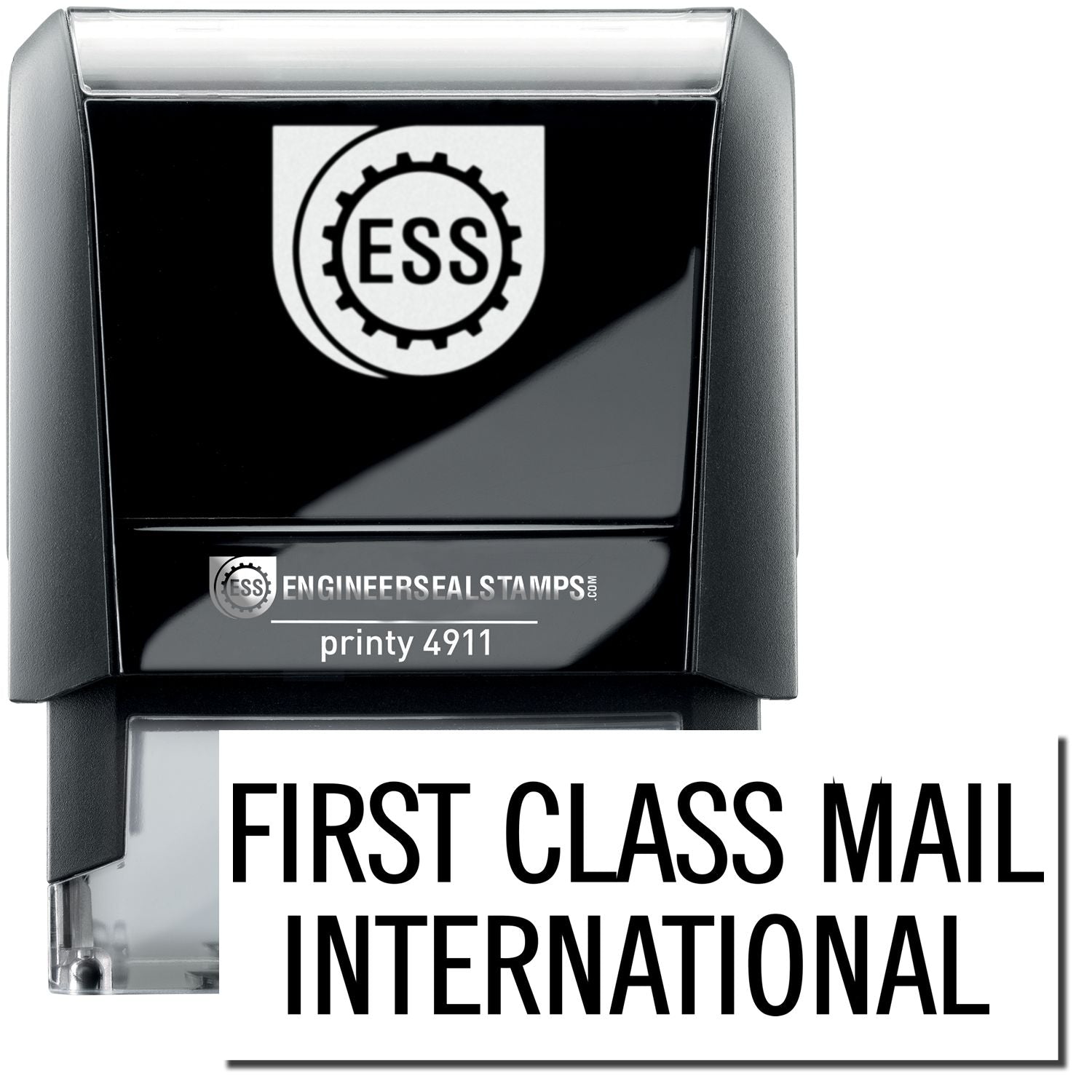 A self-inking stamp with a stamped image showing how the text "FIRST CLASS MAIL INTERNATIONAL" is displayed after stamping.