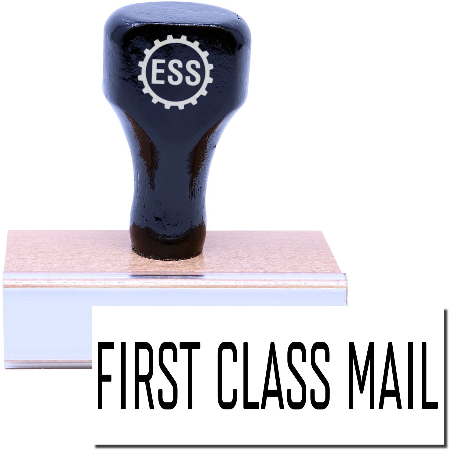 A stock office rubber stamp with a stamped image showing how the text "FIRST CLASS MAIL" in a narrow font is displayed after stamping.