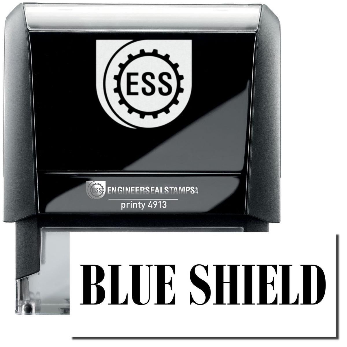 A self-inking stamp with a stamped image showing how the text &quot;BLUE SHIELD&quot; in a large bold font is displayed by it.