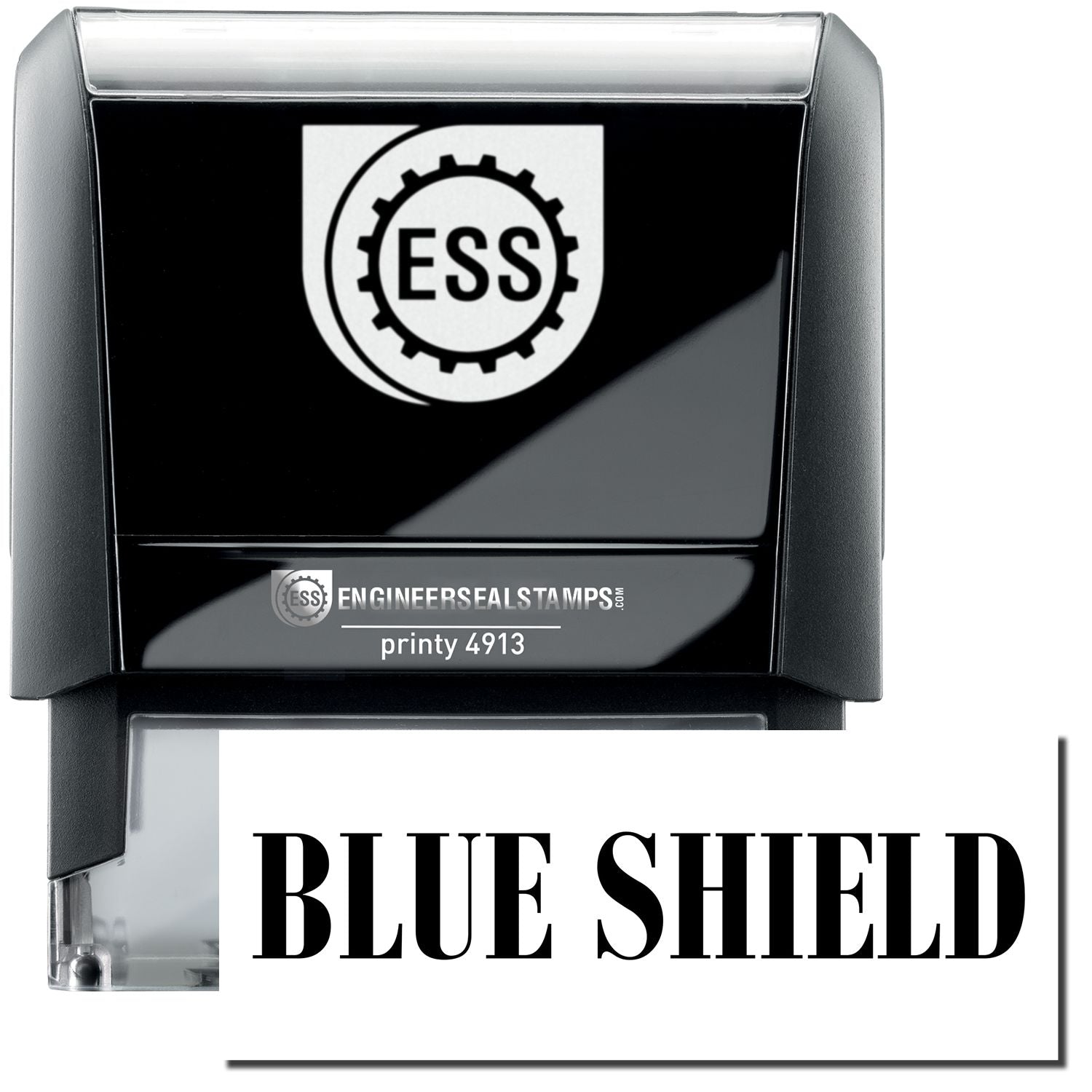 A self-inking stamp with a stamped image showing how the text "BLUE SHIELD" in a large bold font is displayed by it.