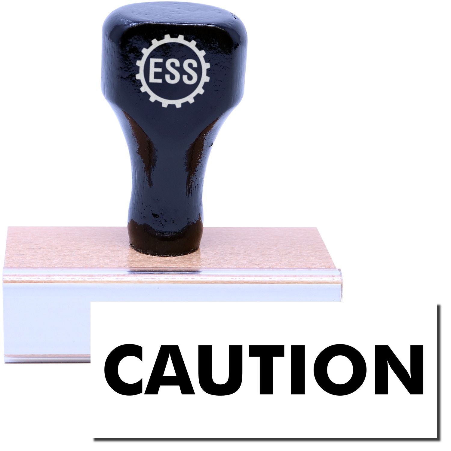 A stock office rubber stamp with a stamped image showing how the text CAUTION in a large font is displayed after stamping.