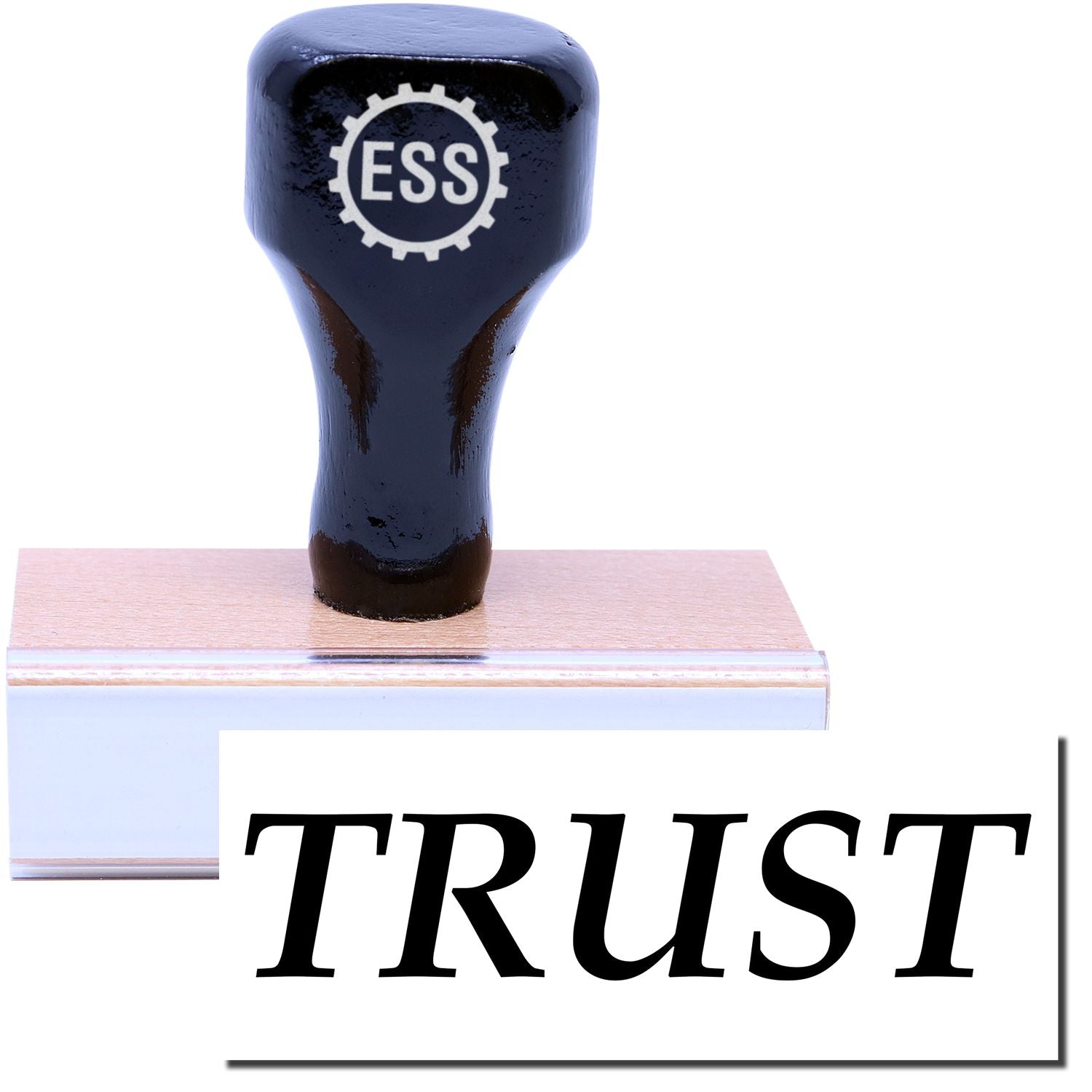 A stock office rubber stamp with a stamped image showing how the text TRUST in a large font is displayed after stamping.