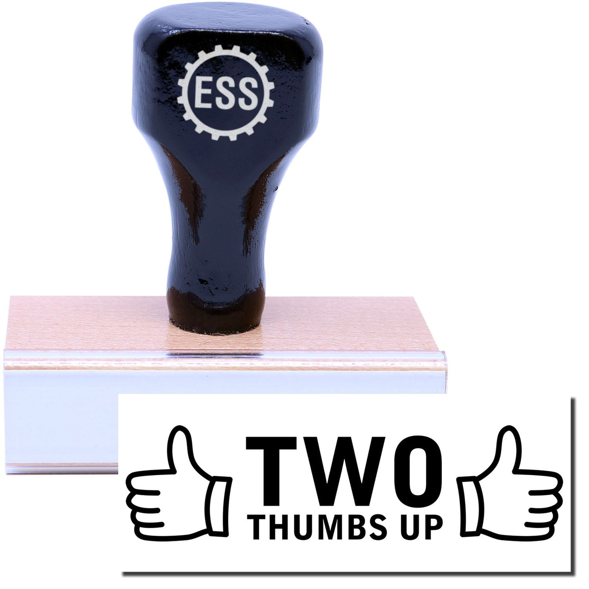 A stock office rubber stamp with a stamped image showing how the text &quot;TWO THUMBS UP&quot; in large font with two thumbs pointing up on each side of the text is displayed after stamping.
