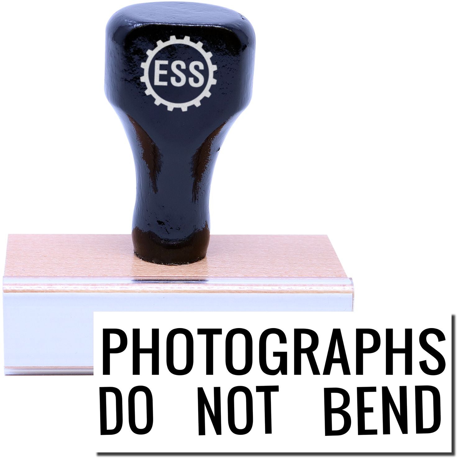 A stock office rubber stamp with a stamped image showing how the text "PHOTOGRAPHS DO NOT BEND" is displayed after stamping.