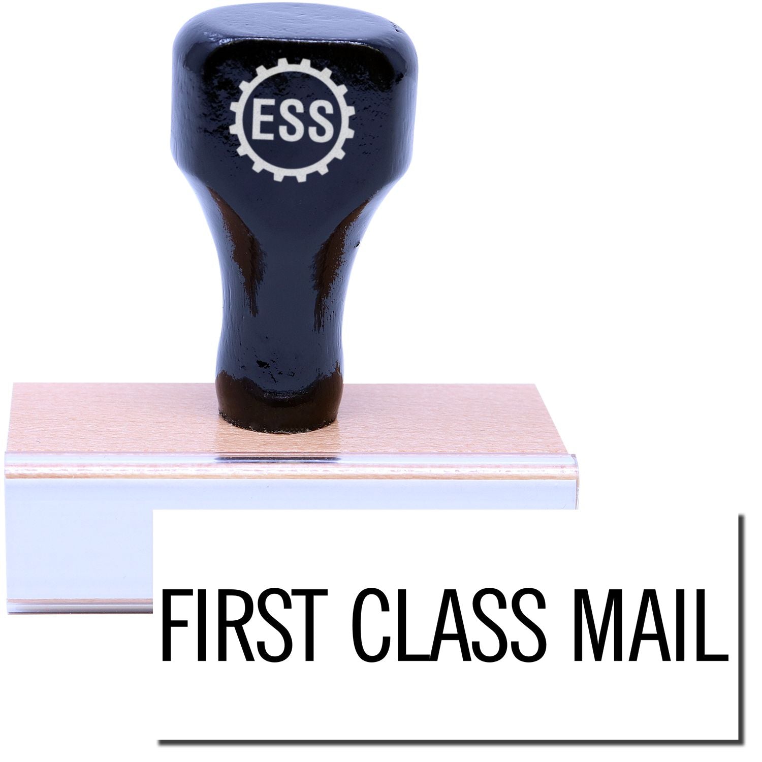 A stock office rubber stamp with a stamped image showing how the text "FIRST CLASS MAIL" in a narrow font is displayed after stamping.