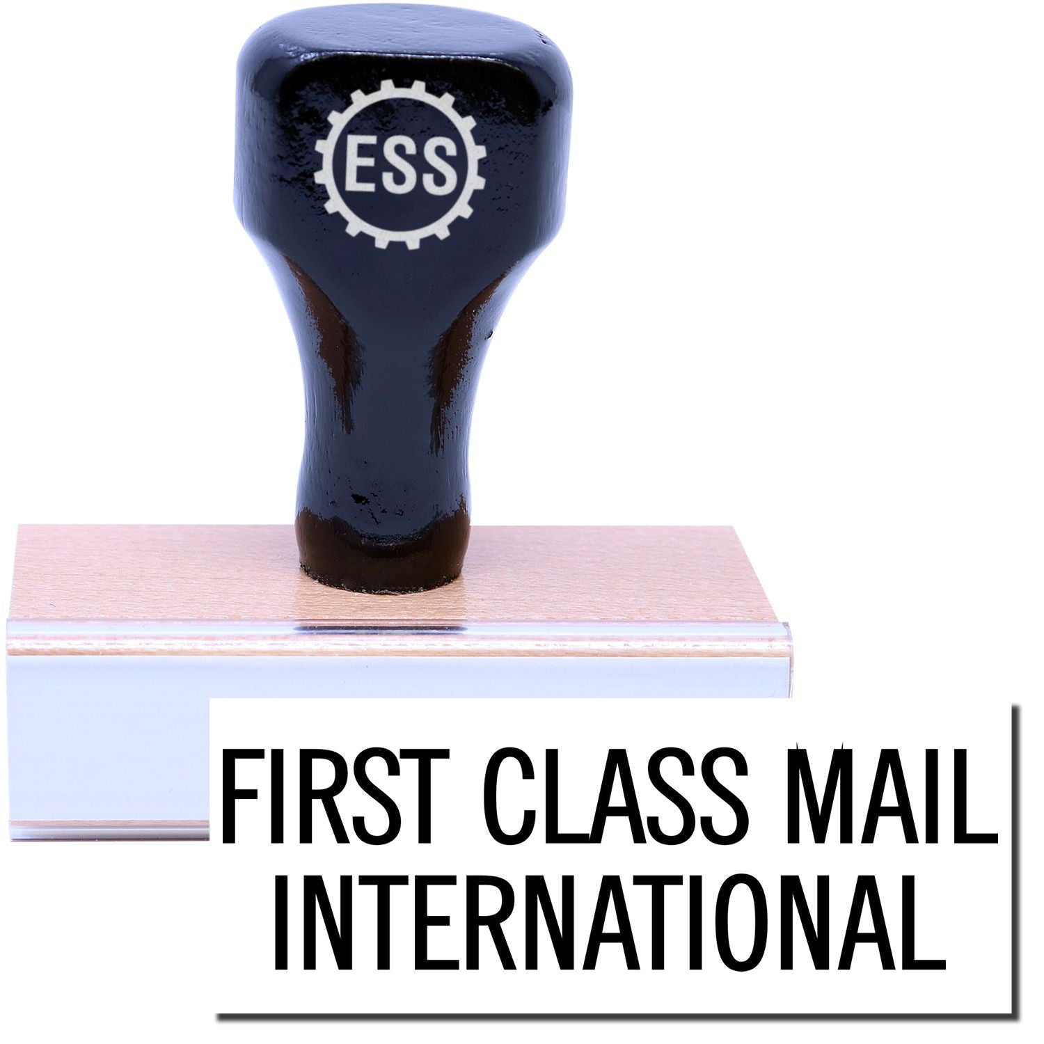 A stock office rubber stamp with a stamped image showing how the text FIRST CLASS MAIL INTERNATIONAL in a large font is displayed after stamping.