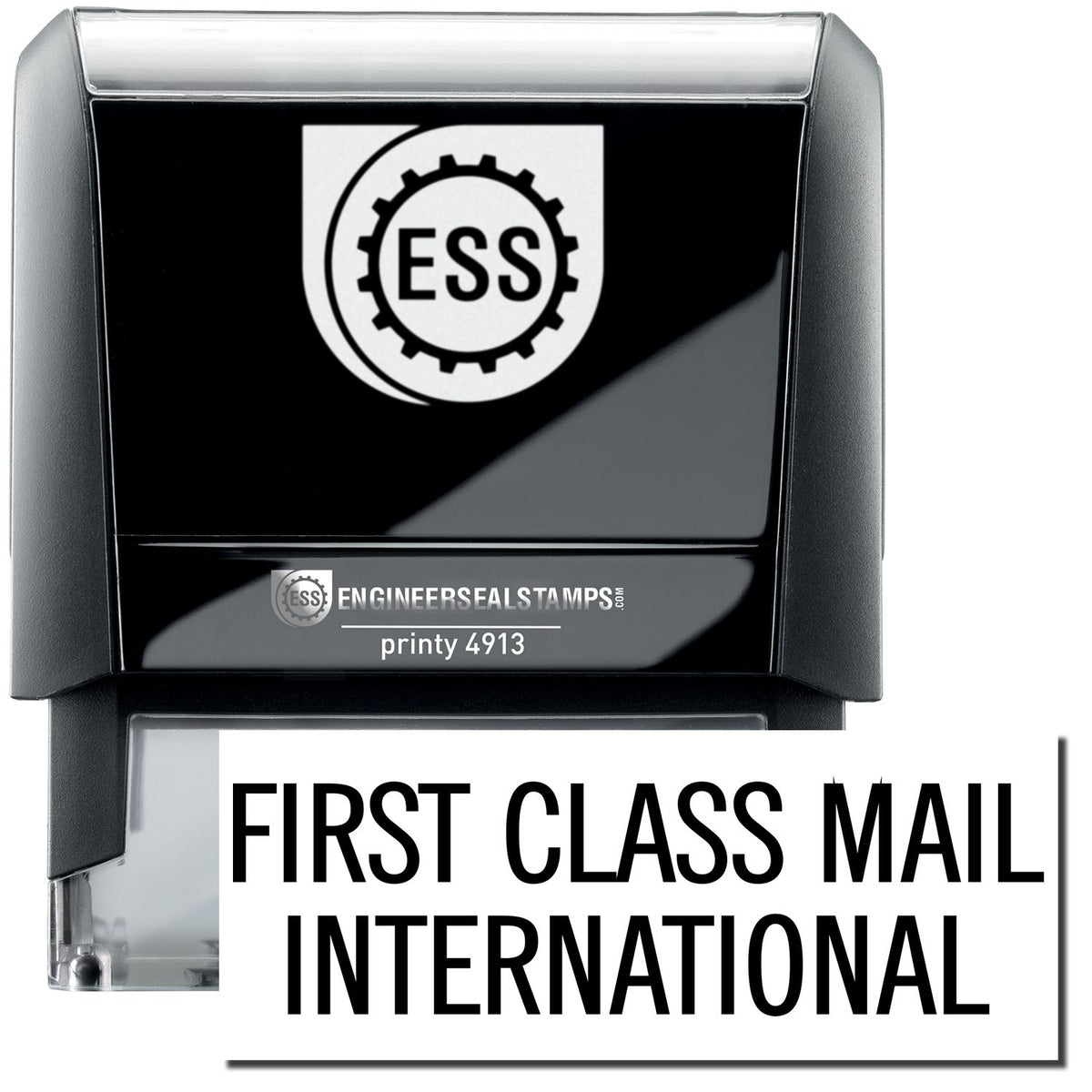 A self-inking stamp with a stamped image showing how the text &quot;FIRST CLASS MAIL INTERNATIONAL&quot; in a large font is displayed by it after stamping.