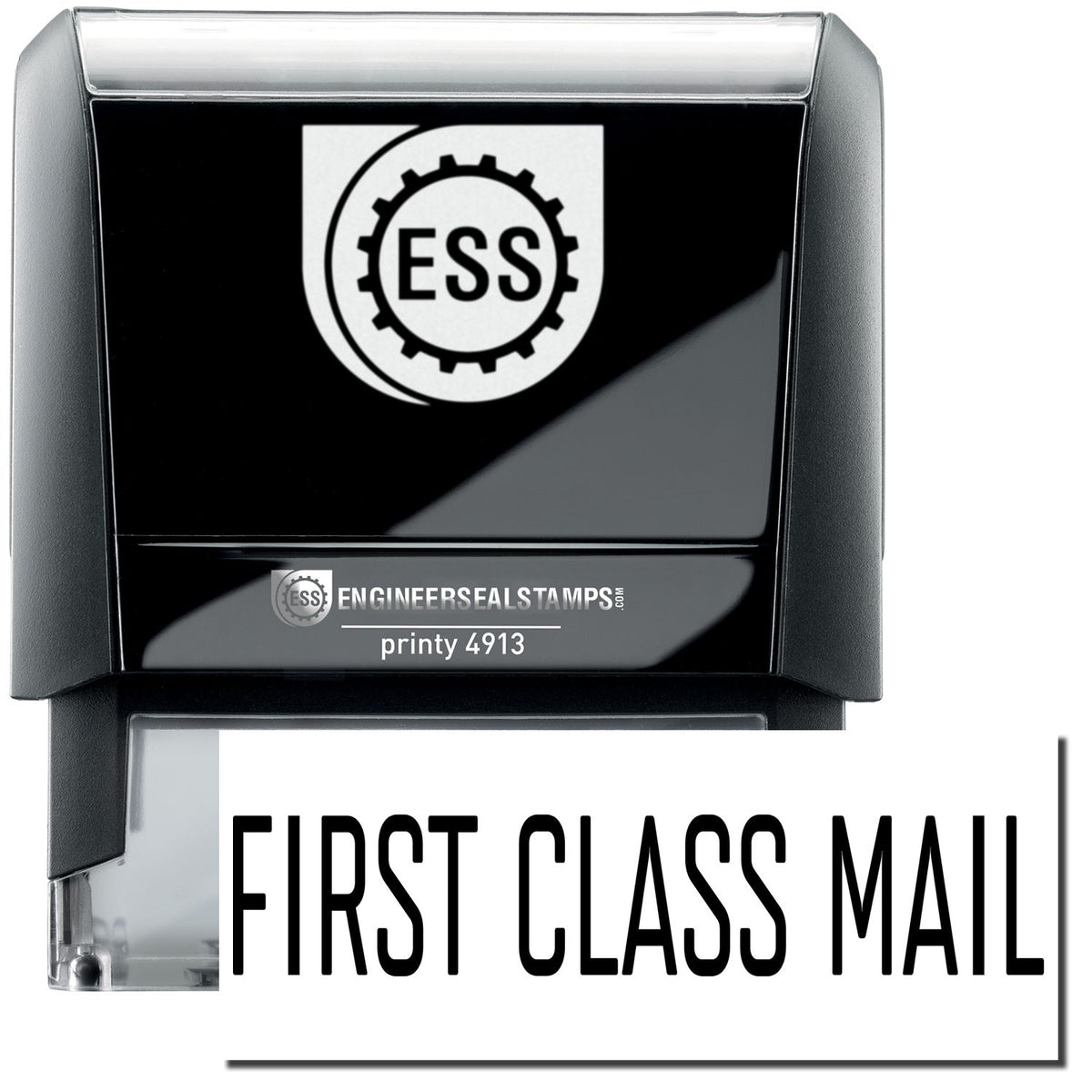 A self-inking stamp with a stamped image showing how the text &quot;FIRST CLASS MAIL&quot; in a large narrow font is displayed by it after stamping.