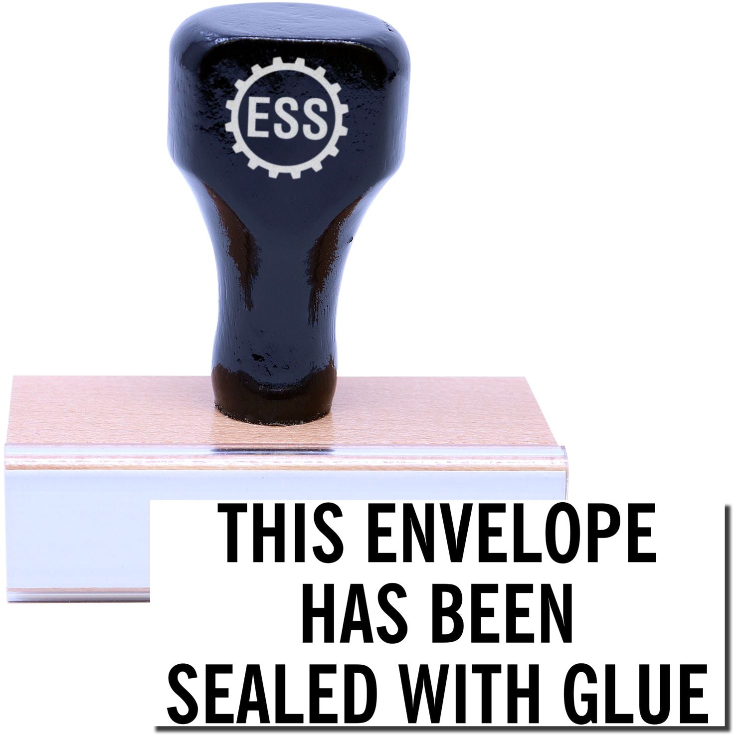 A stock office rubber stamp with a stamped image showing how the text "THIS ENVELOPE HAS BEEN SEALED WITH GLUE" in a large font is displayed after stamping.