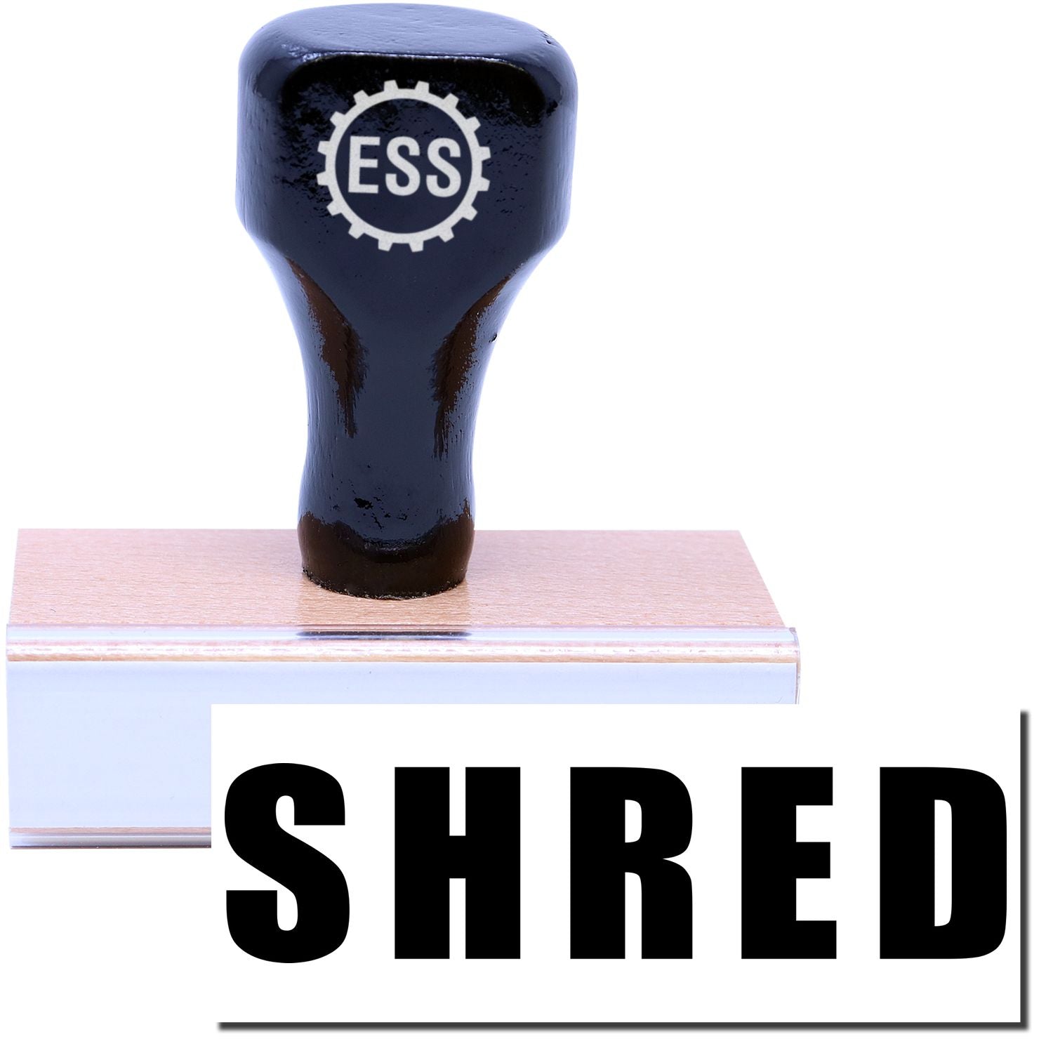 A stock office rubber stamp with a stamped image showing how the text SHRED in a large bold font is displayed after stamping.