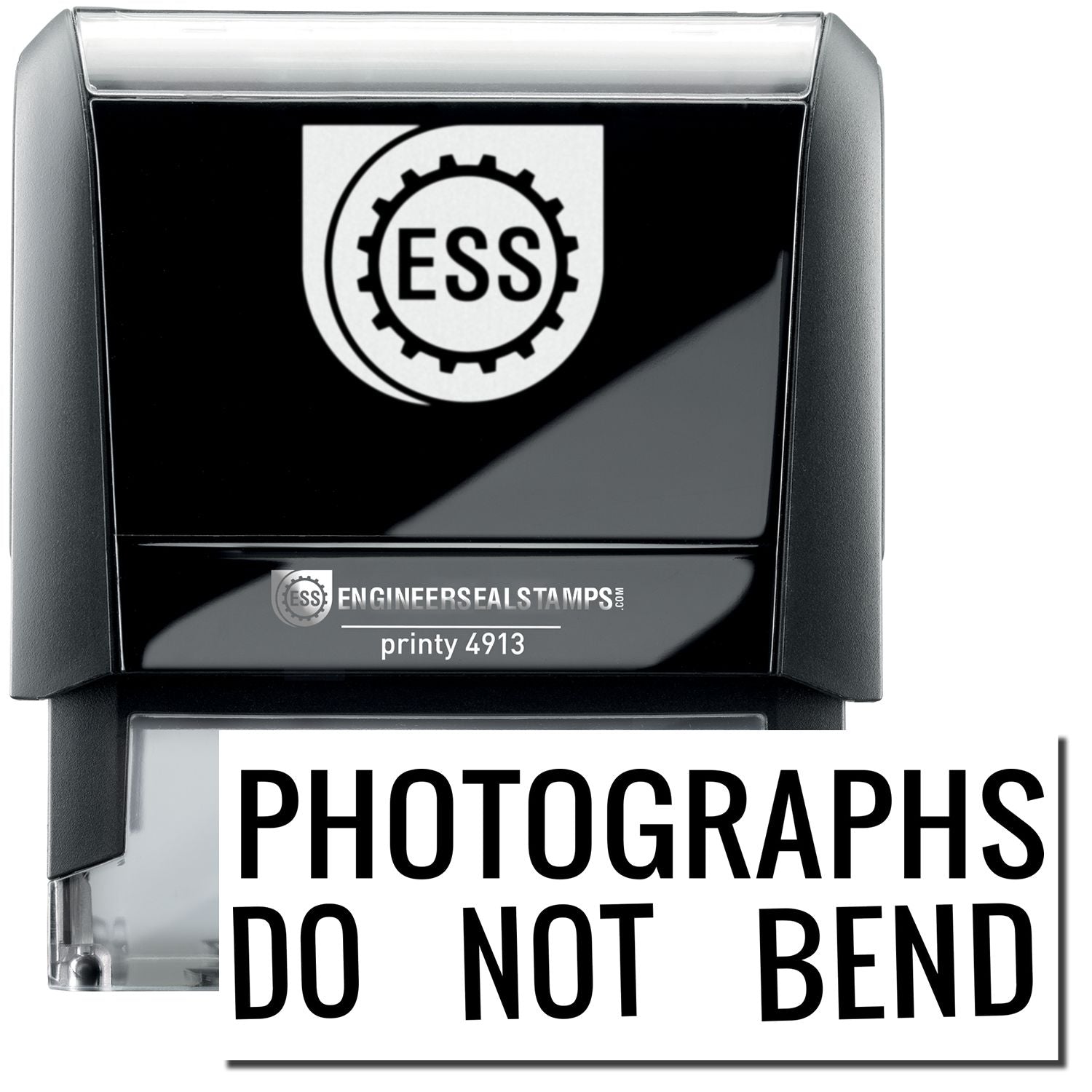 A self-inking stamp with a stamped image showing how the text PHOTOGRAPHS DO NOT BEND in a large font is displayed by it after stamping.