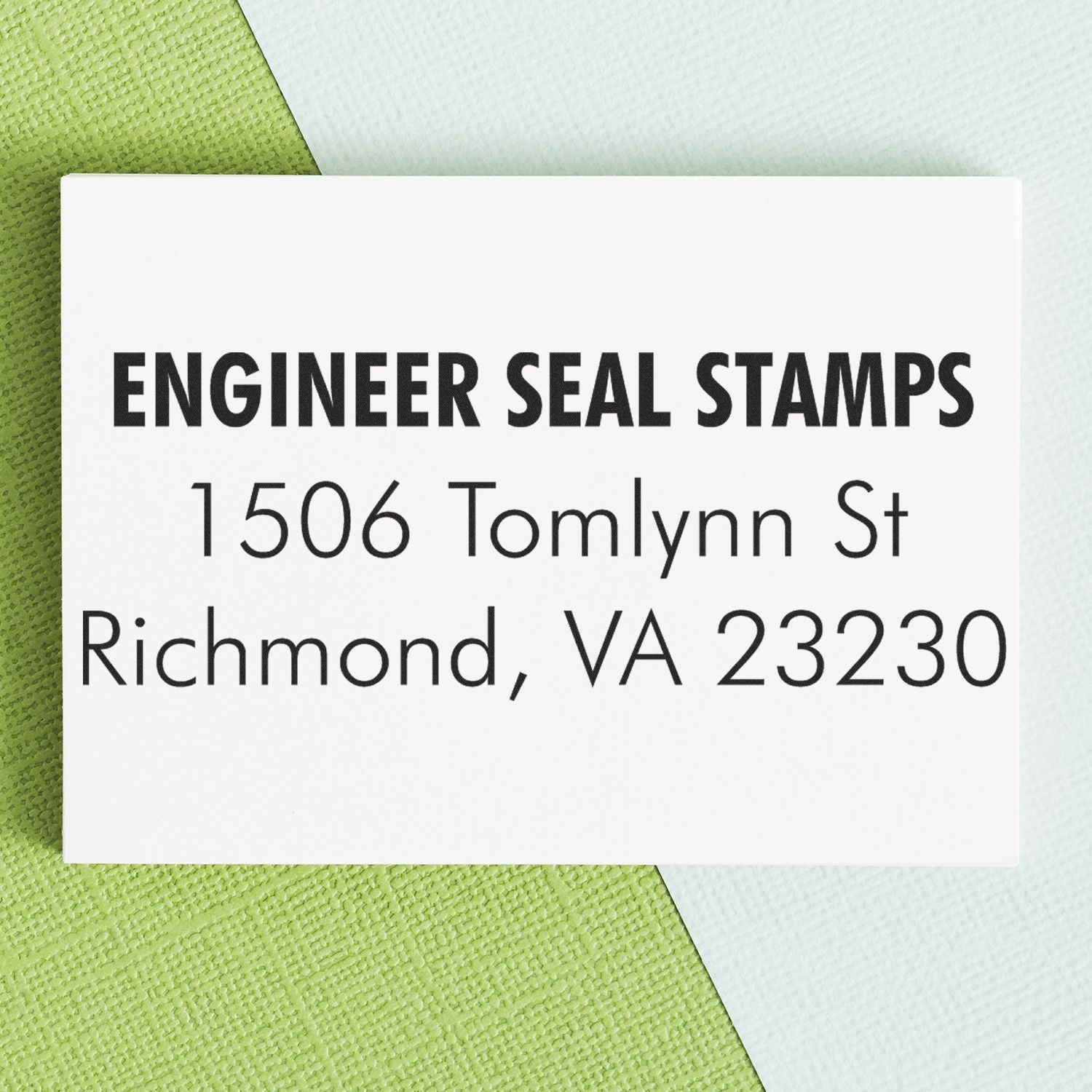 3 Line Address Stamp - Regular Rubber Stamp displaying ENGINEER SEAL STAMPS, 1506 Tomlynn St, Richmond, VA 23230 on a green and blue background.