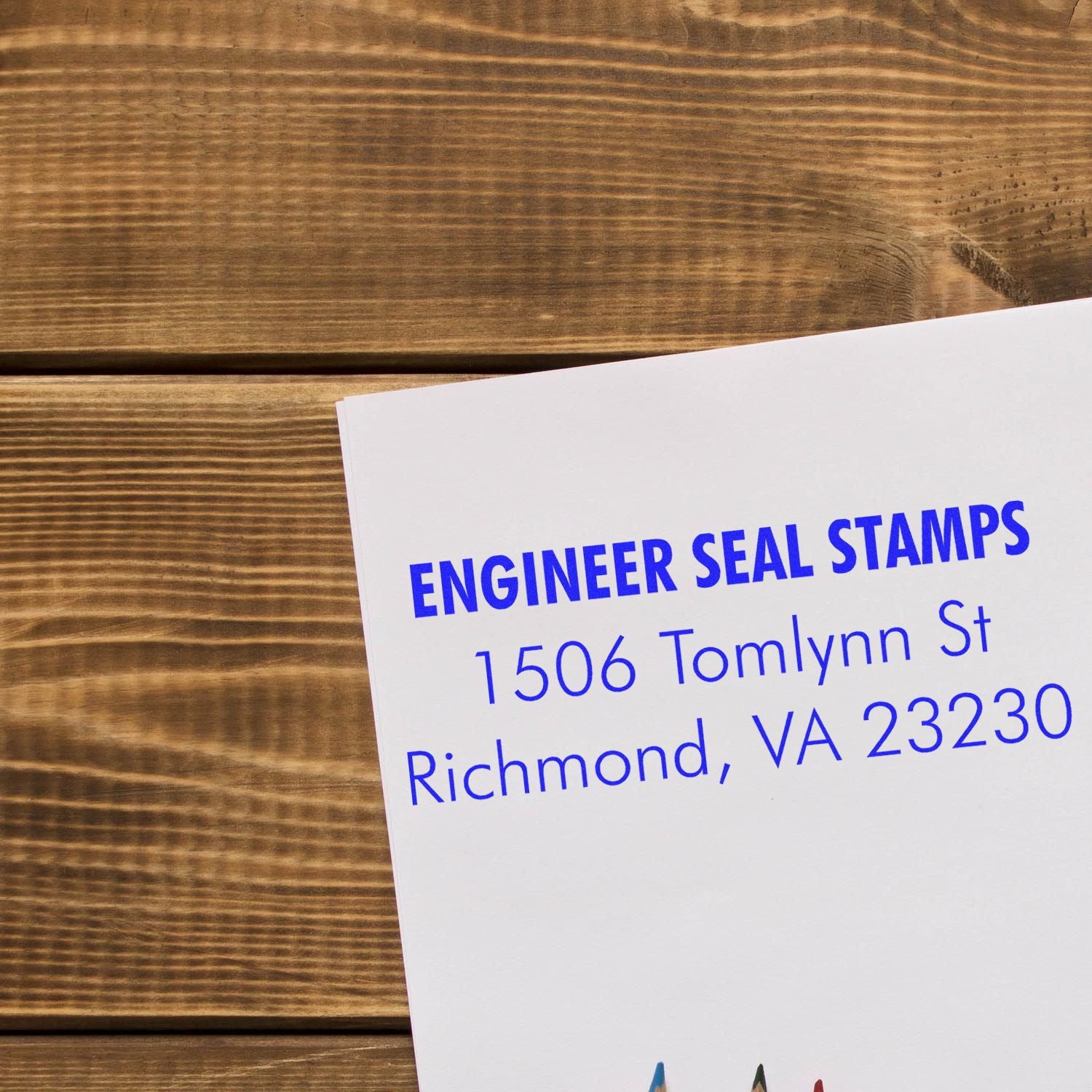 3 Line Self Inking Address Stamp used on a white envelope, displaying ENGINEER SEAL STAMPS, 1506 Tomlynn St, Richmond, VA 23230 in blue ink.