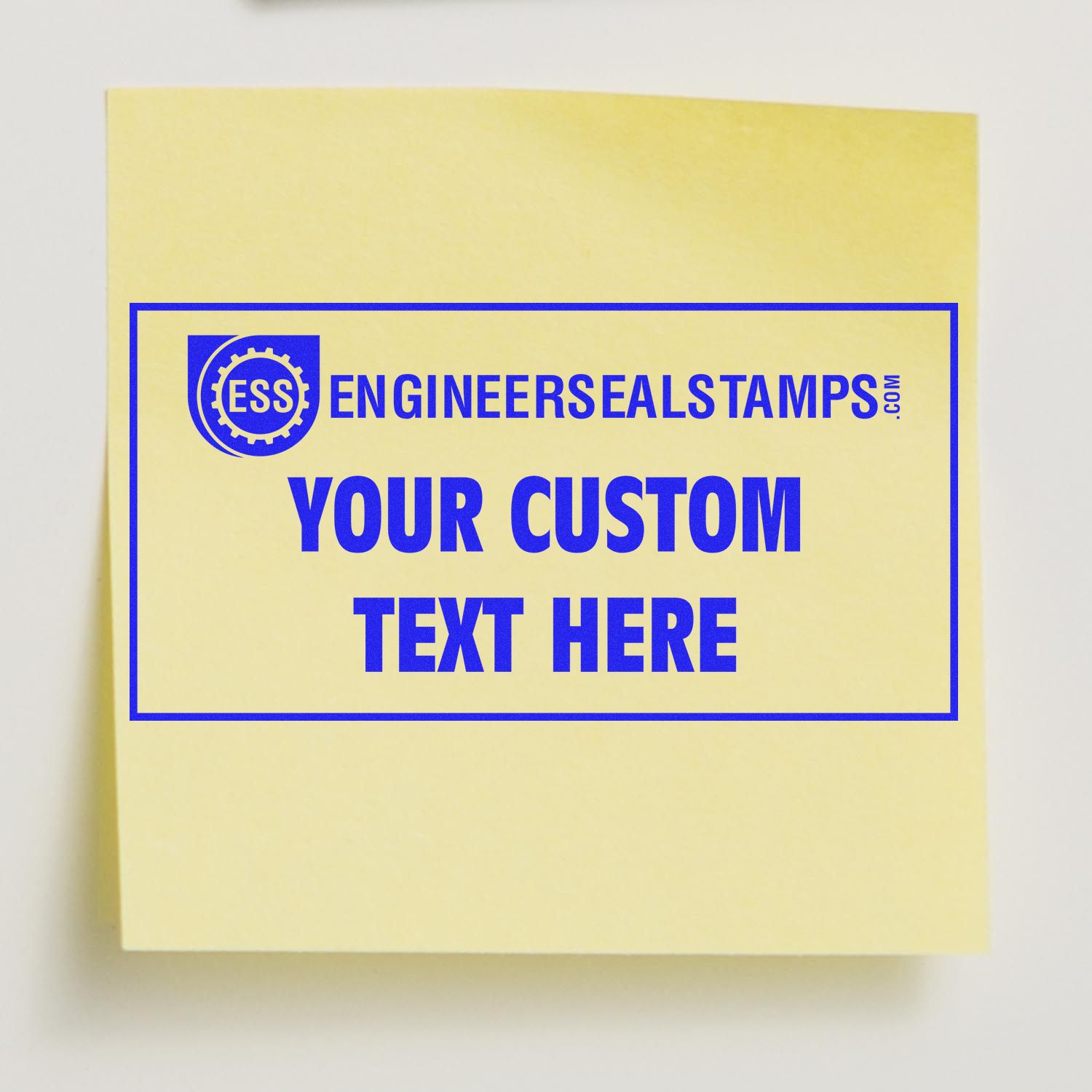 Custom Rubber Stamp Size 5 x 10 imprinting YOUR CUSTOM TEXT HERE on a yellow sticky note, showcasing the stamp's clear and bold print.