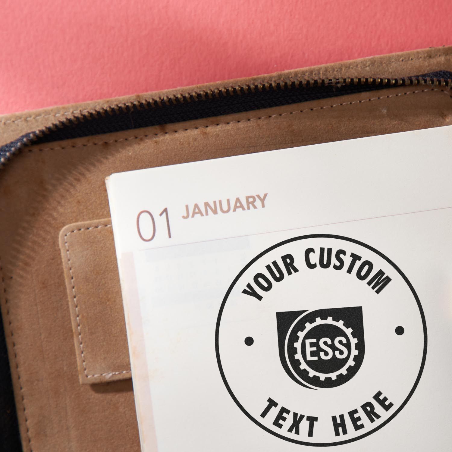 Custom Rubber Stamp Size 2-1/2 Inch Diameter used on a calendar page with Your Custom Text Here and ESS logo in the center.