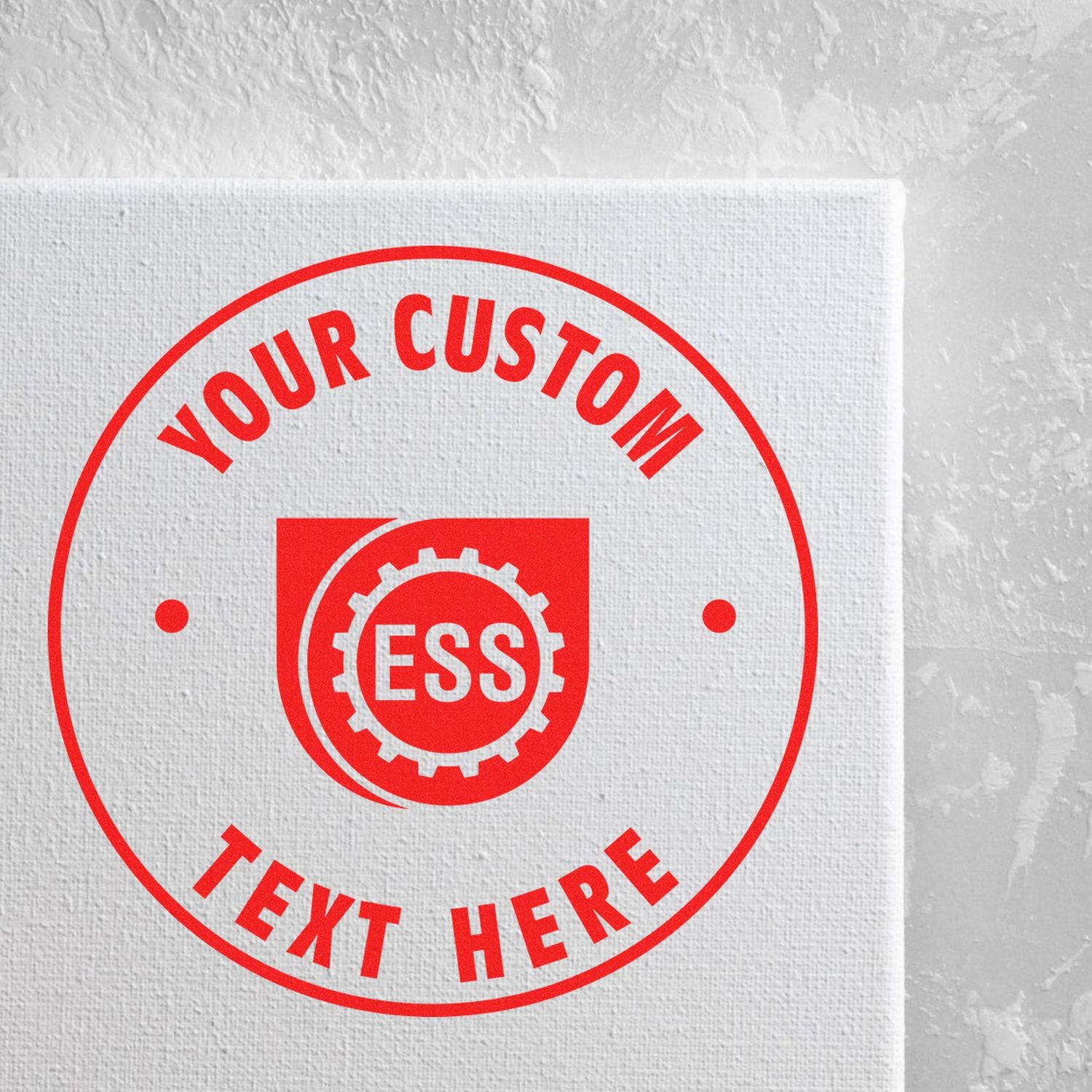 Custom Self Inking Stamp Trodat 46050 Size 2 Diameter in red ink on white textured surface with Your Custom Text Here and ESS logo.