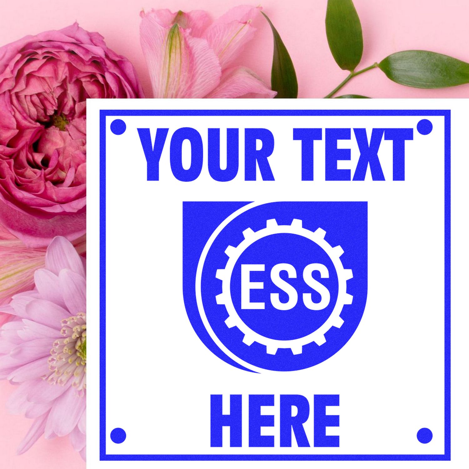 Custom Rubber Stamp Size 1 x 1 with YOUR TEXT HERE in blue, placed on a pink background with flowers.