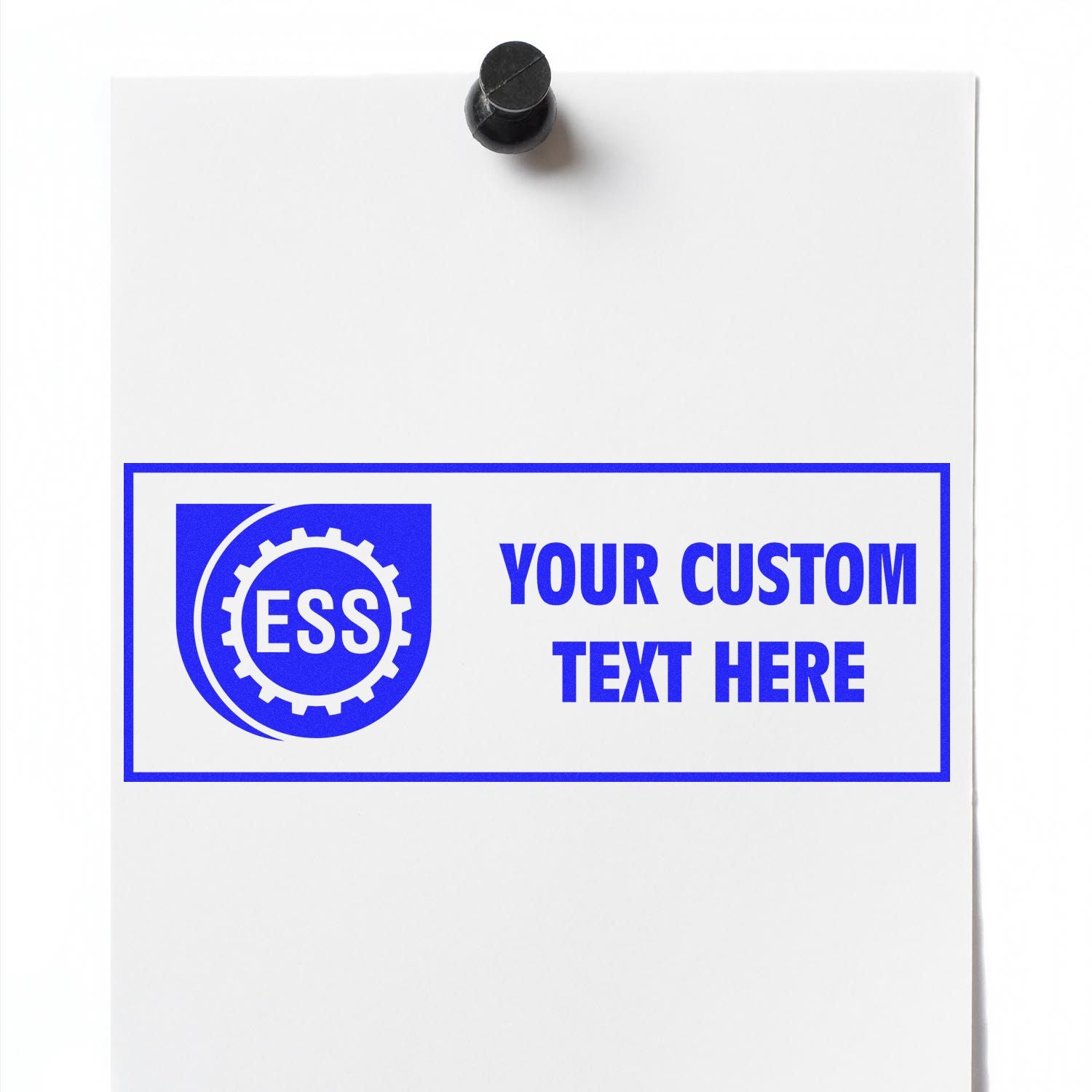 Custom Rubber Stamp Size 2 x 4 in blue ink on white paper with ESS logo and YOUR CUSTOM TEXT HERE message, pinned to a board.