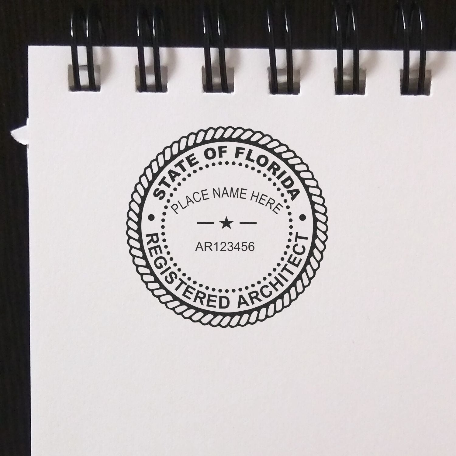 Digital Florida Architect Stamp, Electronic Seal for Florida Architect, displayed on a white notepad with a black spiral binding.