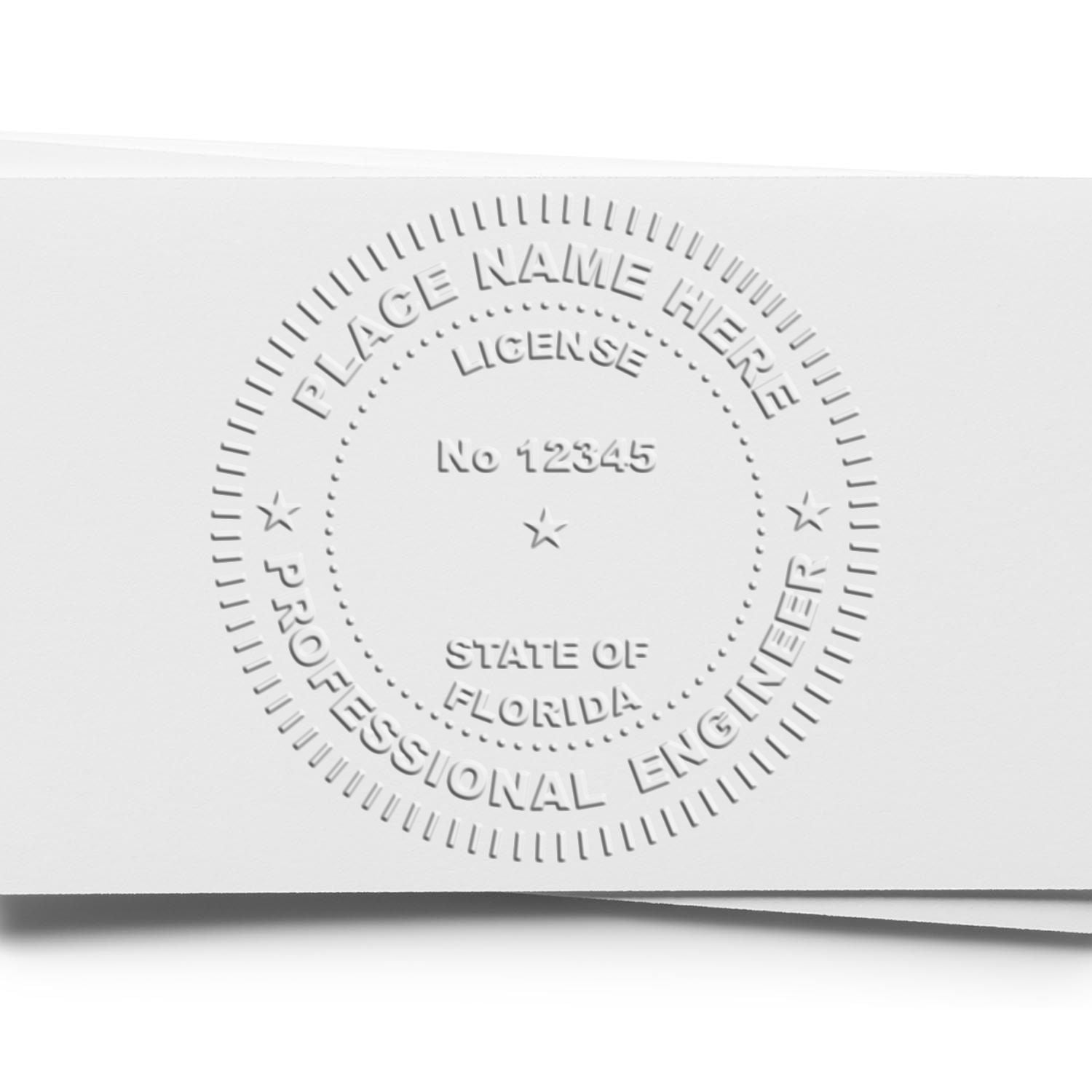 An in use photo of the Hybrid Florida Engineer Seal showing a sample imprint on a cardstock