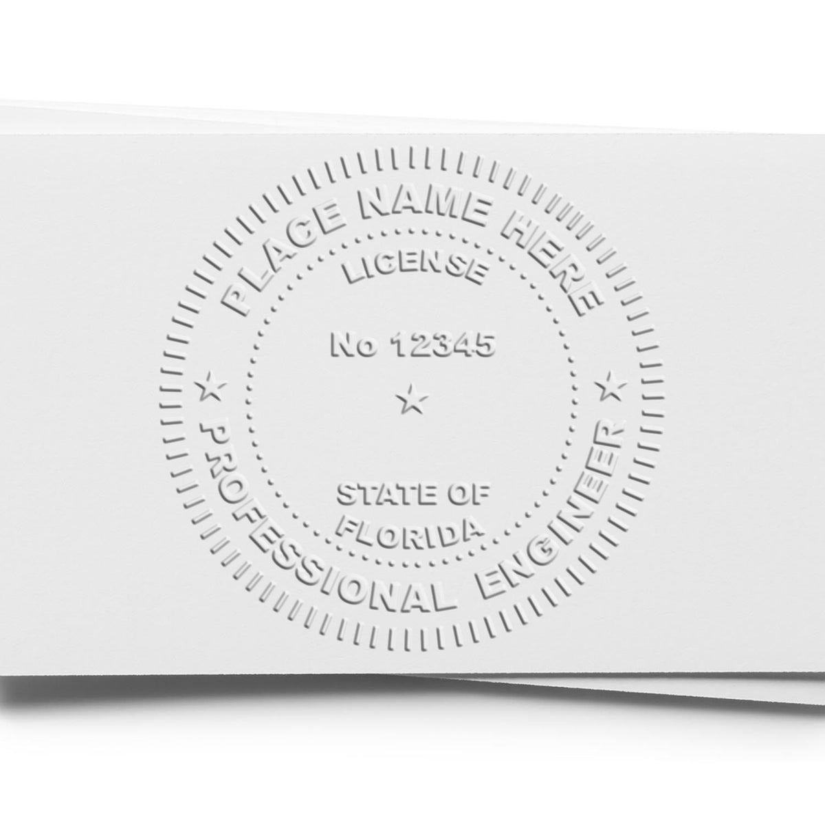 An in use photo of the Hybrid Florida Engineer Seal showing a sample imprint on a cardstock