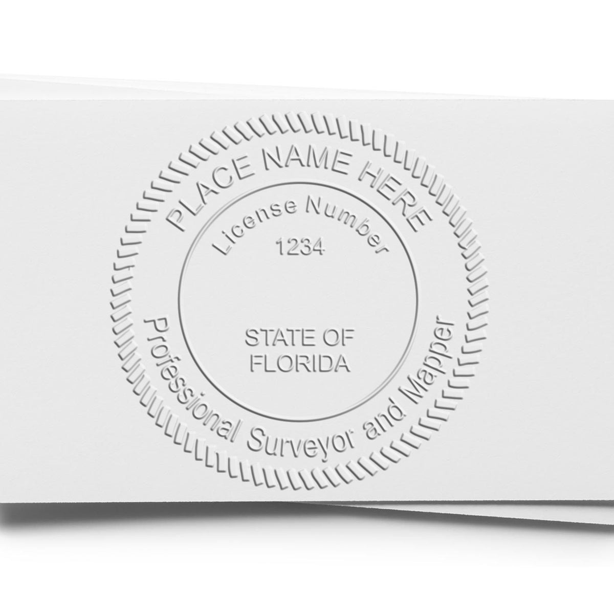 An alternative view of the Heavy Duty Cast Iron Florida Land Surveyor Seal Embosser stamped on a sheet of paper showing the image in use